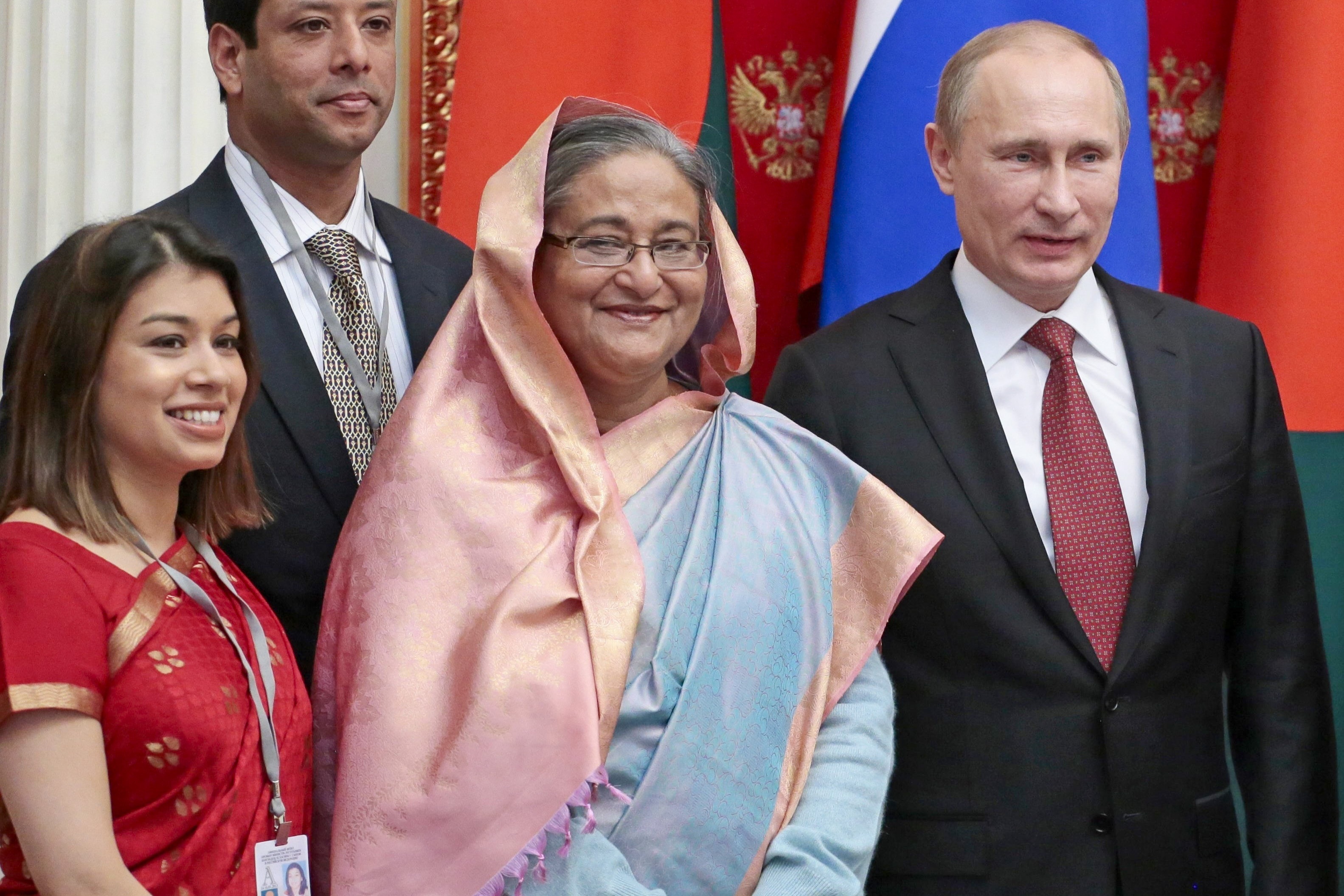 Russian President Vladimir Putin, right, Bangladesh Prime Minister Sheikh Hasina, second right, and Tulip Siddiq, left, attend a signing ceremony in the Kremlin in Moscow, Russia, Tuesday, January 15, 2013