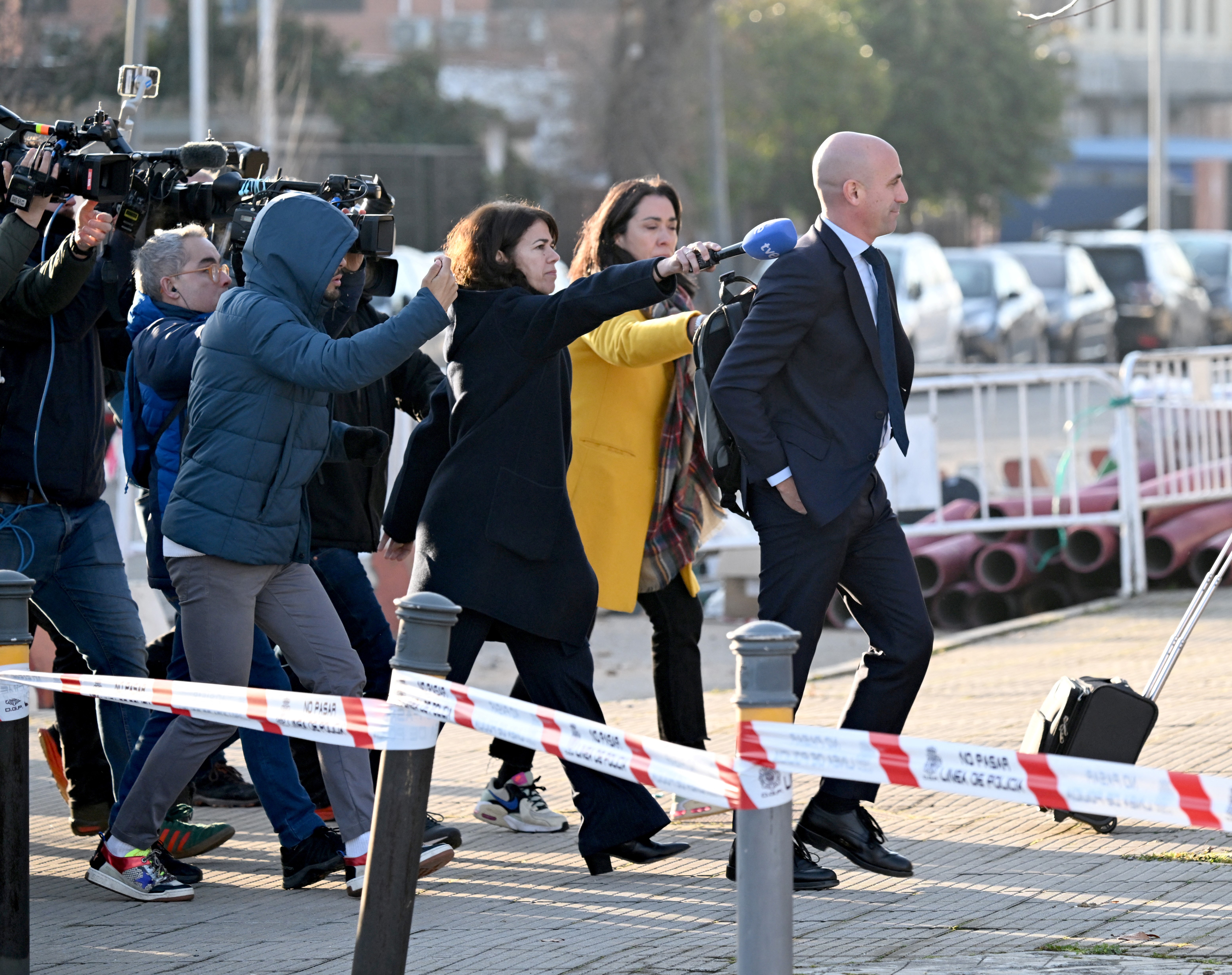 Luis Rubiales walks to court.