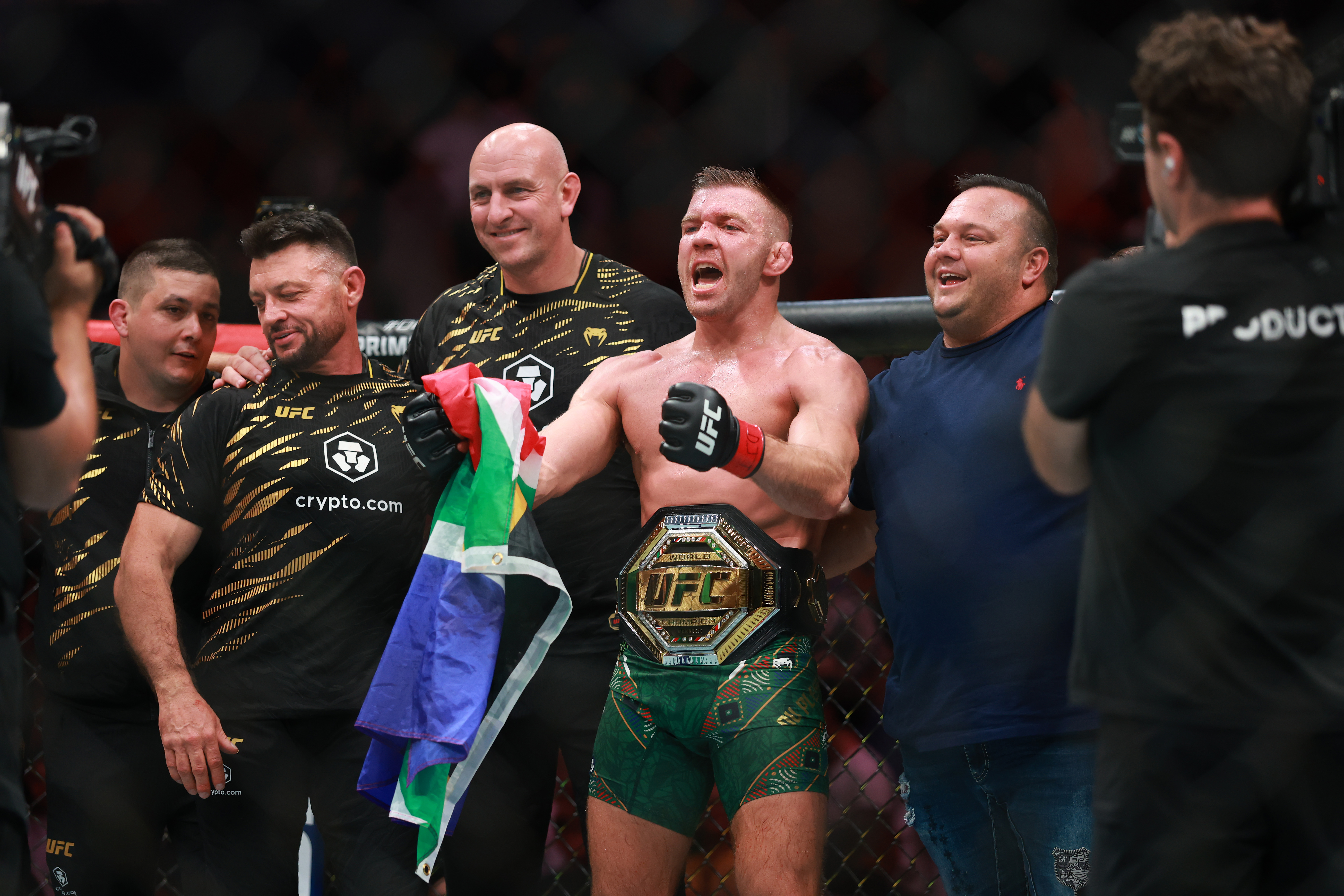 South Africa’s Dircus du Plessis celebrates his victory over Sean Strickland of the US after their middleweight title bout during UFC 312 at Qudos Bank Arena on February 9, 2025, in Sydney, Australia