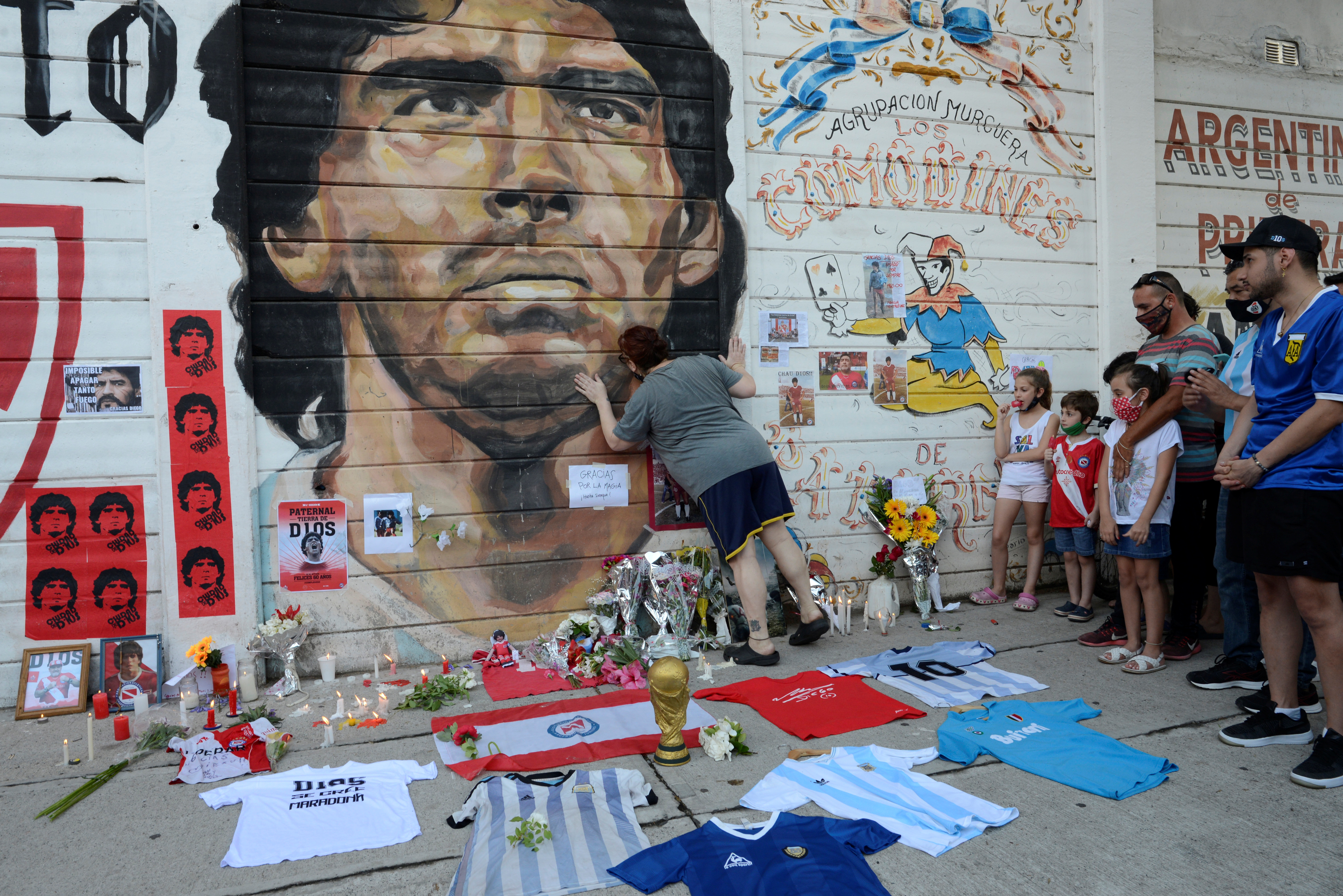 Fans gather to mourn the death of soccer legend Diego Armando Maradona, outside the Diego Armando Maradona stadium, in Buenos Aires, Argentina November 25, 2020. REUTERS/Magali Druscovich