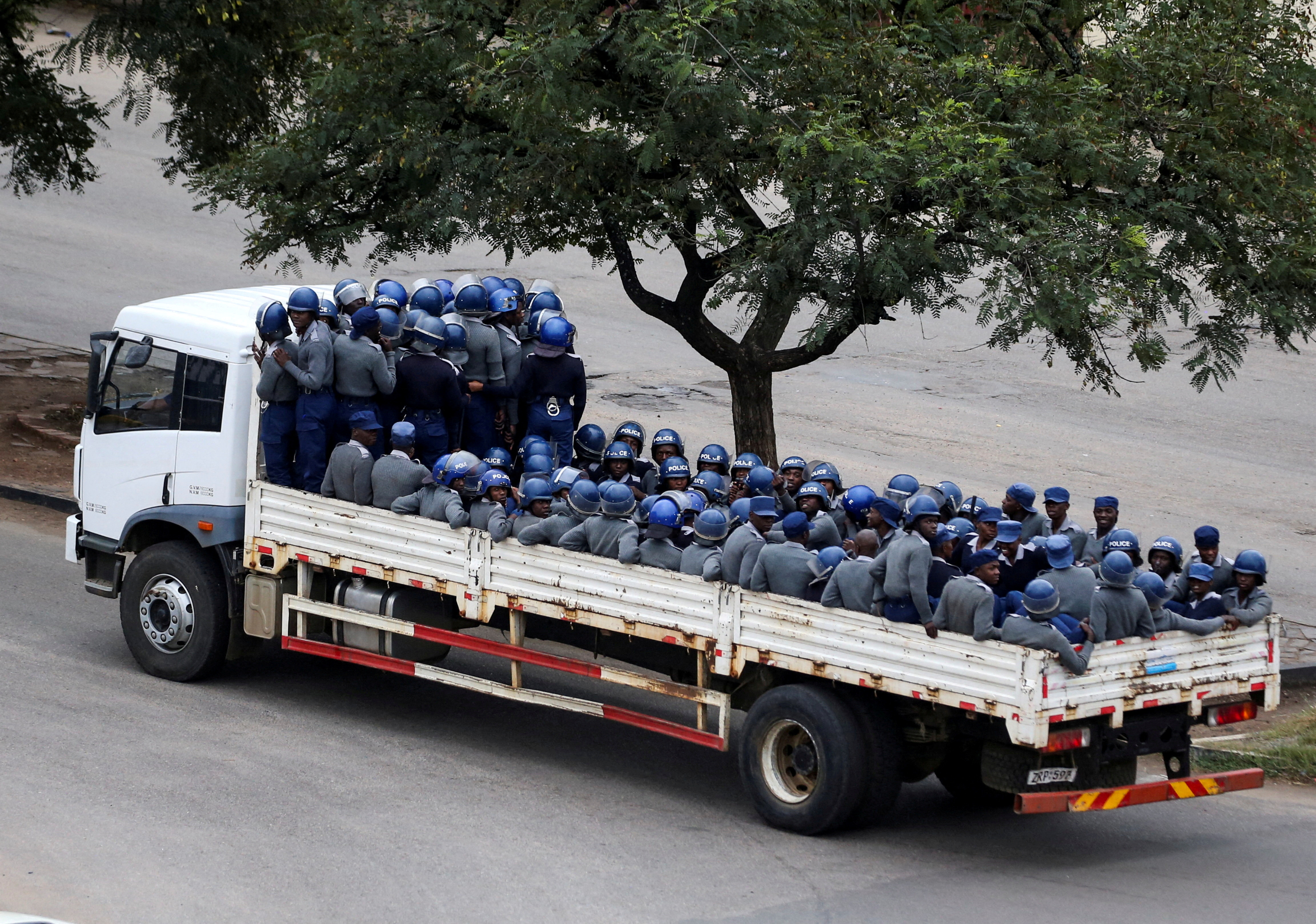 Riot police officers are transported on a truck in the capital Harare, Zimbabwe, March 31, 2025.REUTERS/Philimon Bulawayo TPX IMAGES OF THE DAY