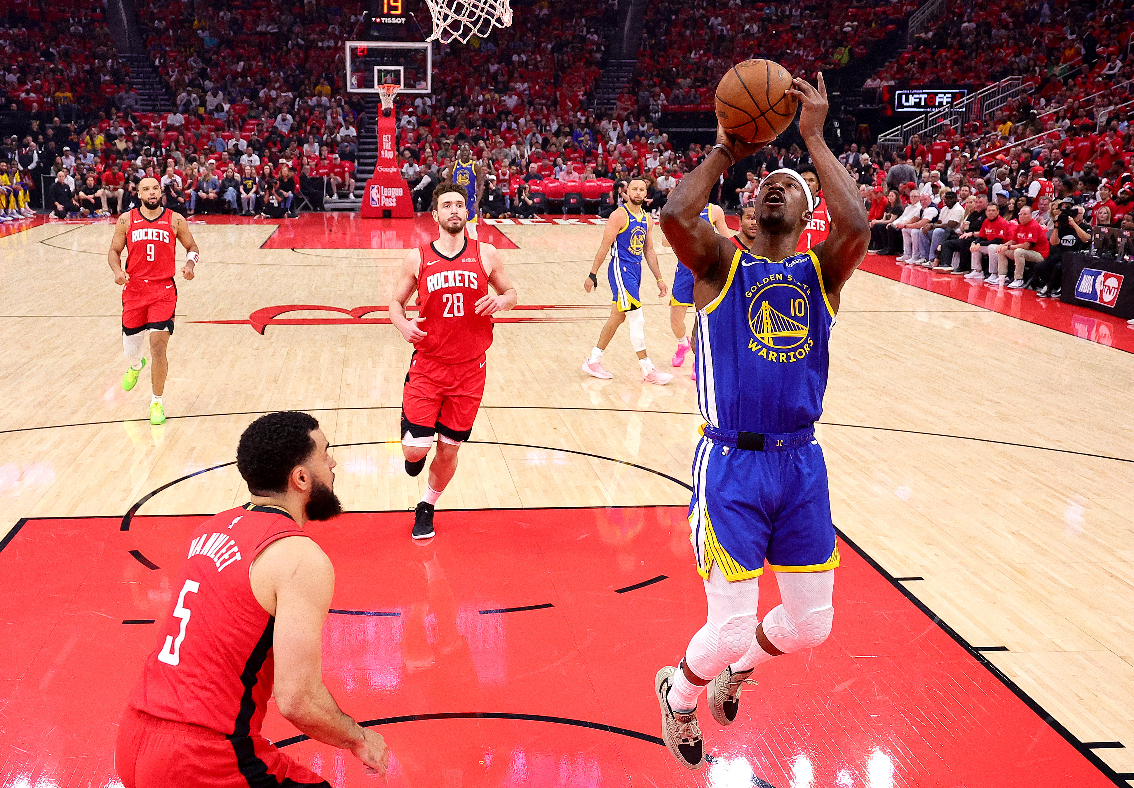 Jimmy Butler III (#10) of the Golden State Warriors attempts a shot against the Houston Rockets in Game 1 of the Western Conference first round NBA playoffs at Toyota Center on April 20, 2025, in Houston, Texas, US