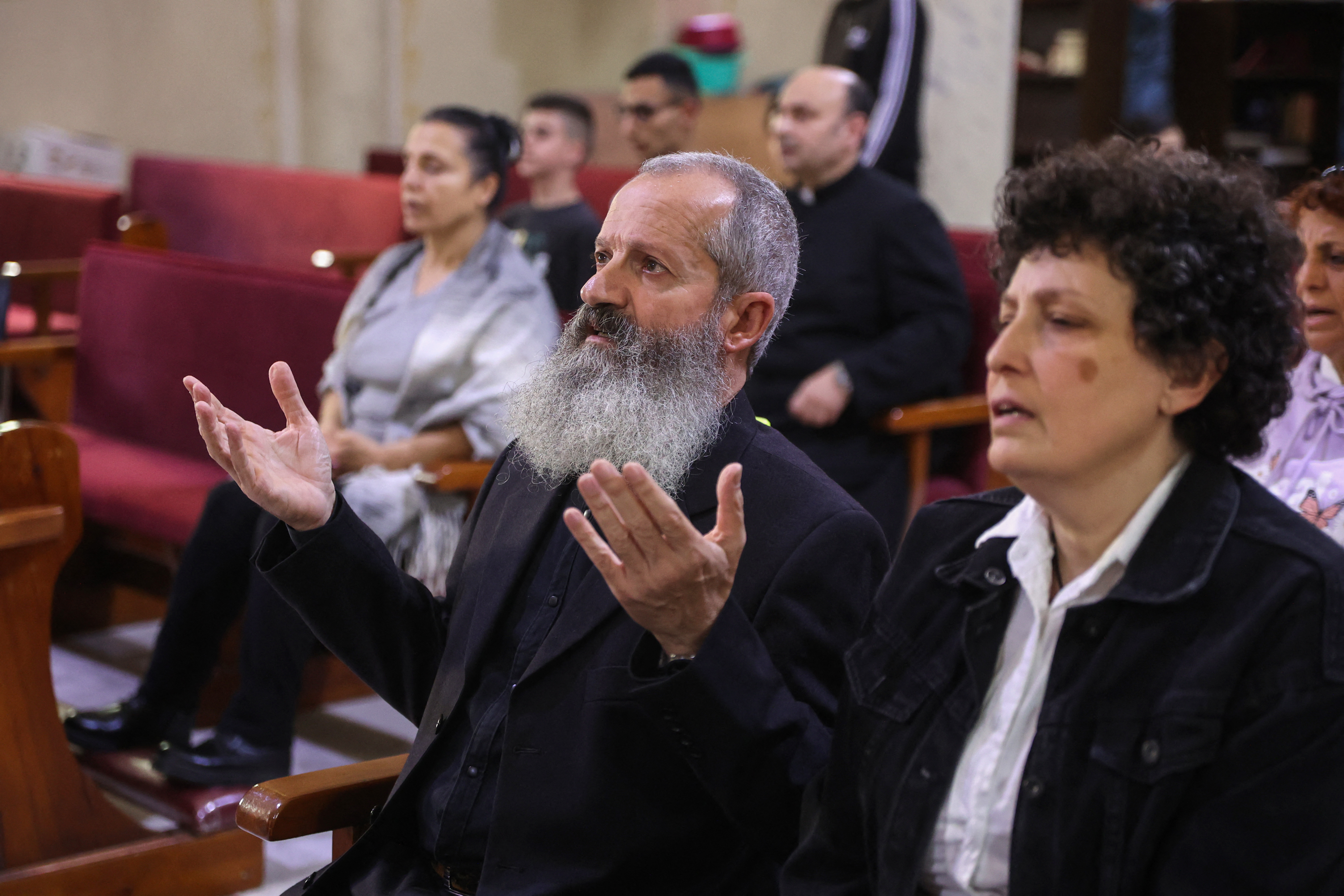 Palestinians attend mass held for late Pope Francis at the Holy Family Church in Gaza