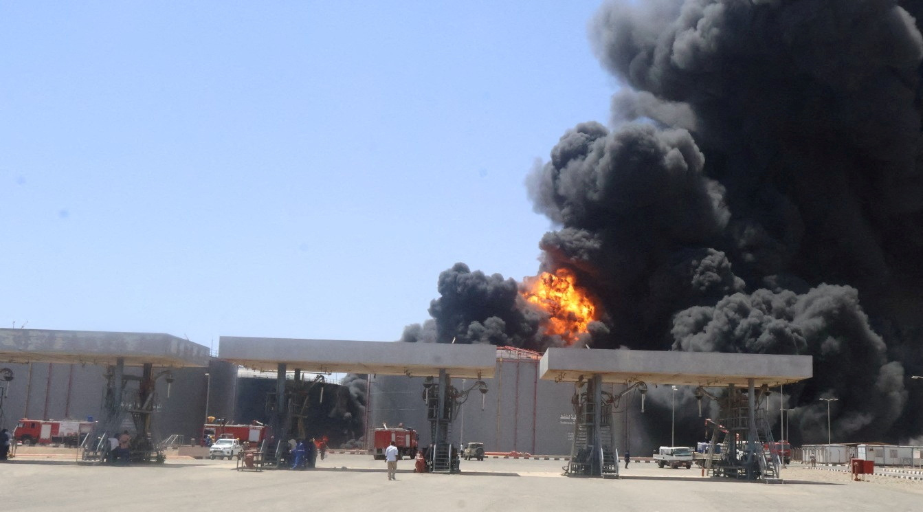 Large plumes of smoke and fire rising from fuel depot in Port Sudan.