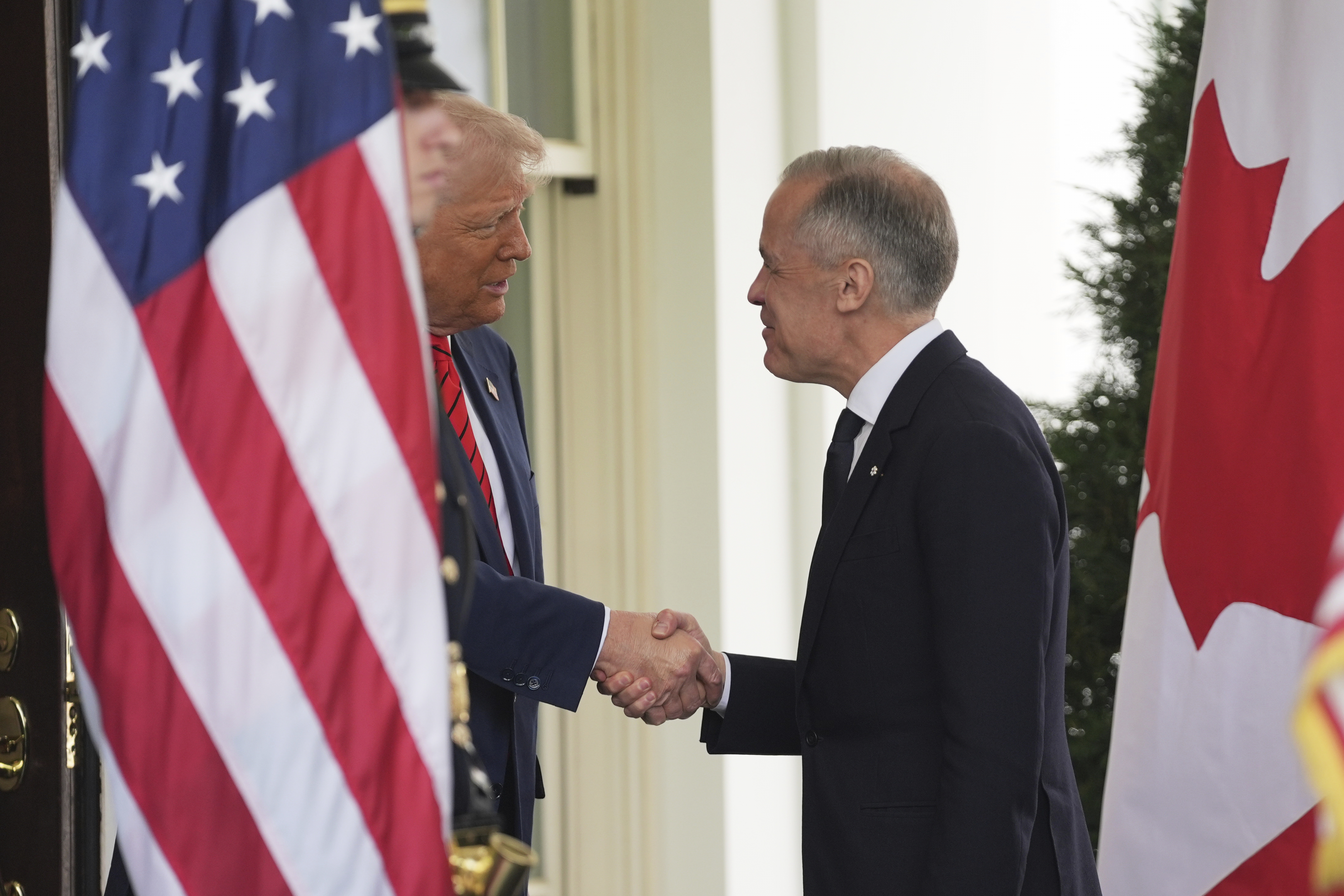 President Donald Trump greets Canadian Prime Minister Mark Carney outside the White House on May 6