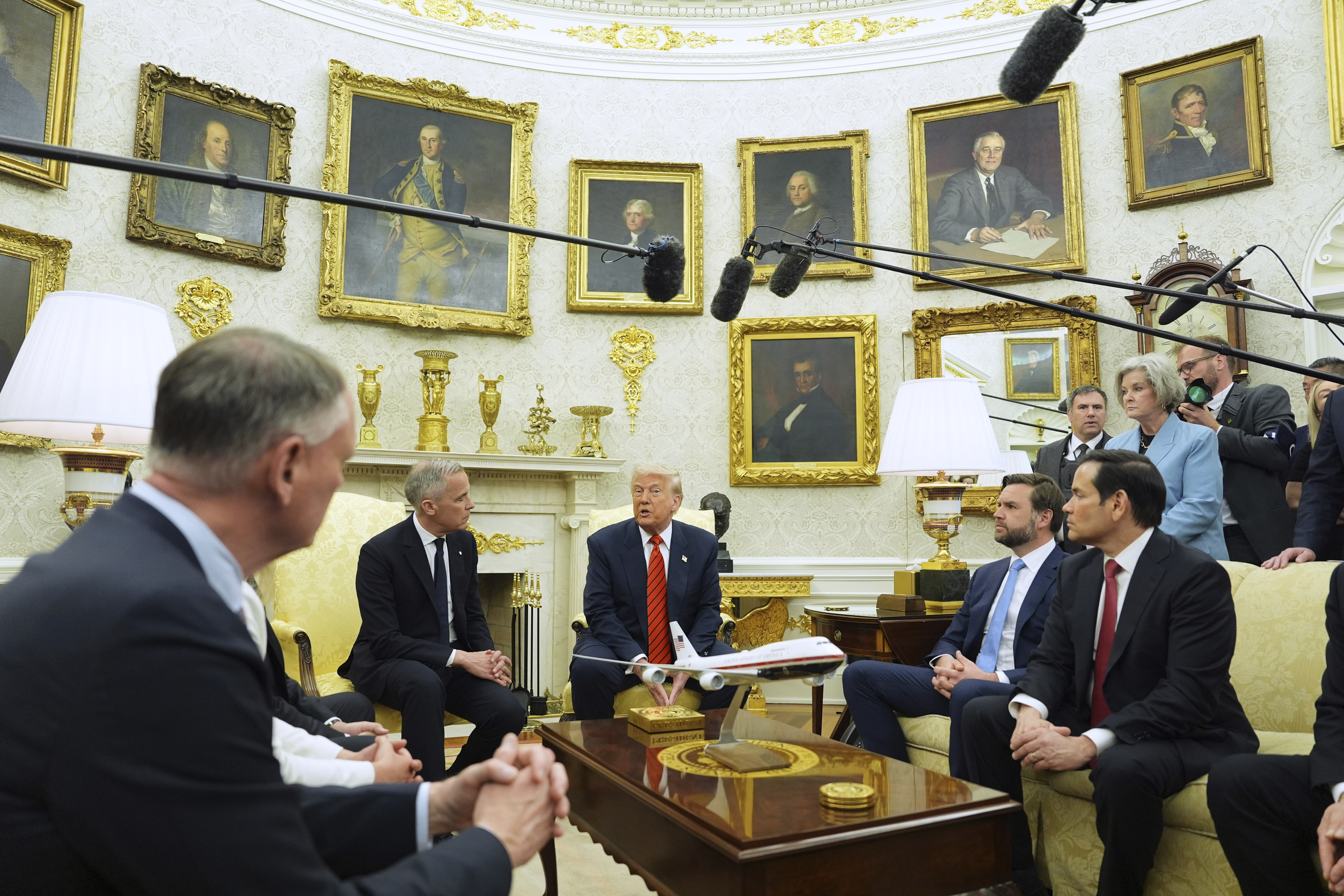 Reporters gather to ask Carney and Trump questions about the future of US-Canada relations