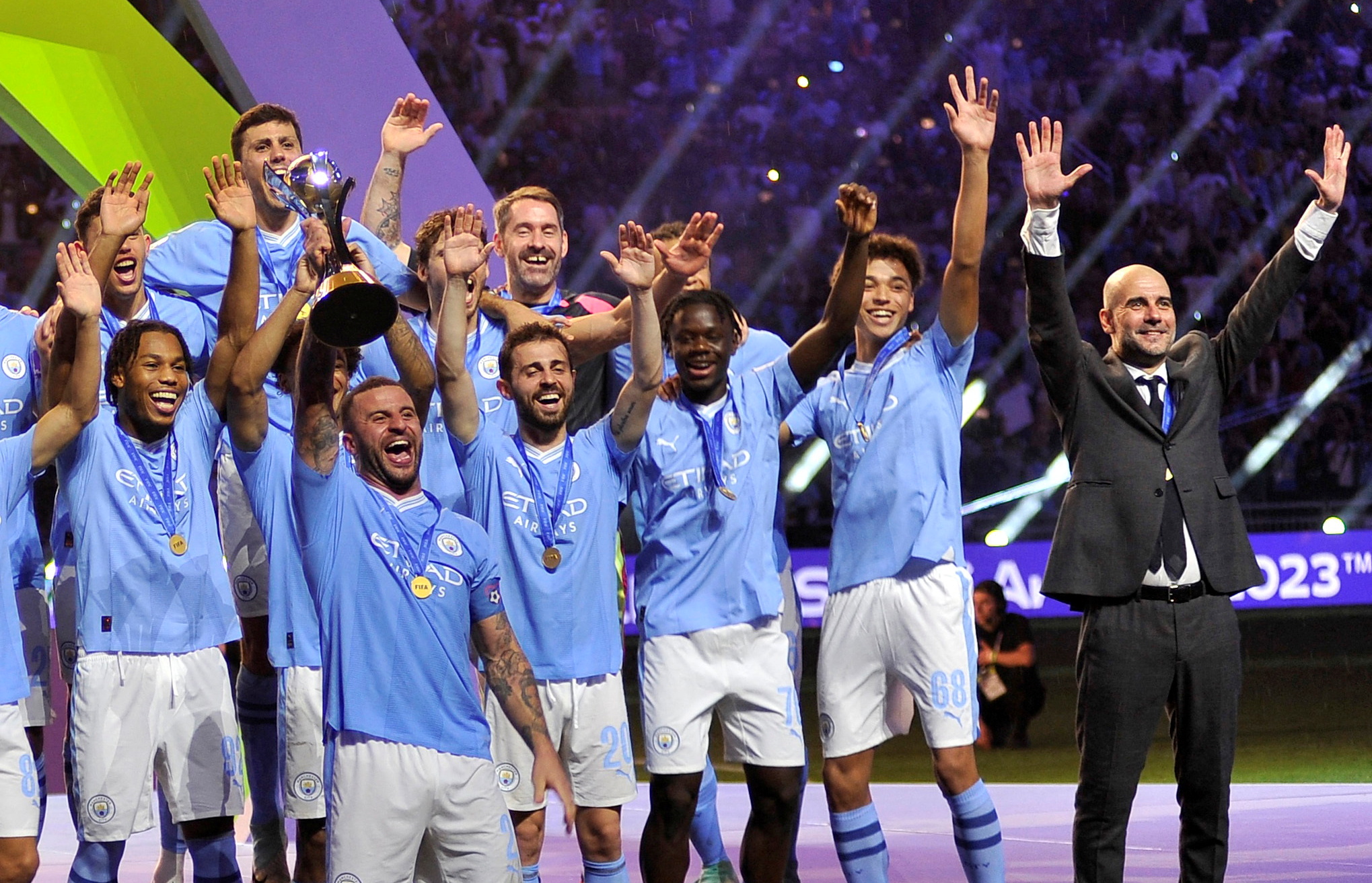 Club World Cup - Final - Manchester City v Fluminense - King Abdullah Sports City, Jeddah, Saudi Arabia - Manchester City's Kyle Walker lifts the trophy alongside teammates after winning the Club World Cup final