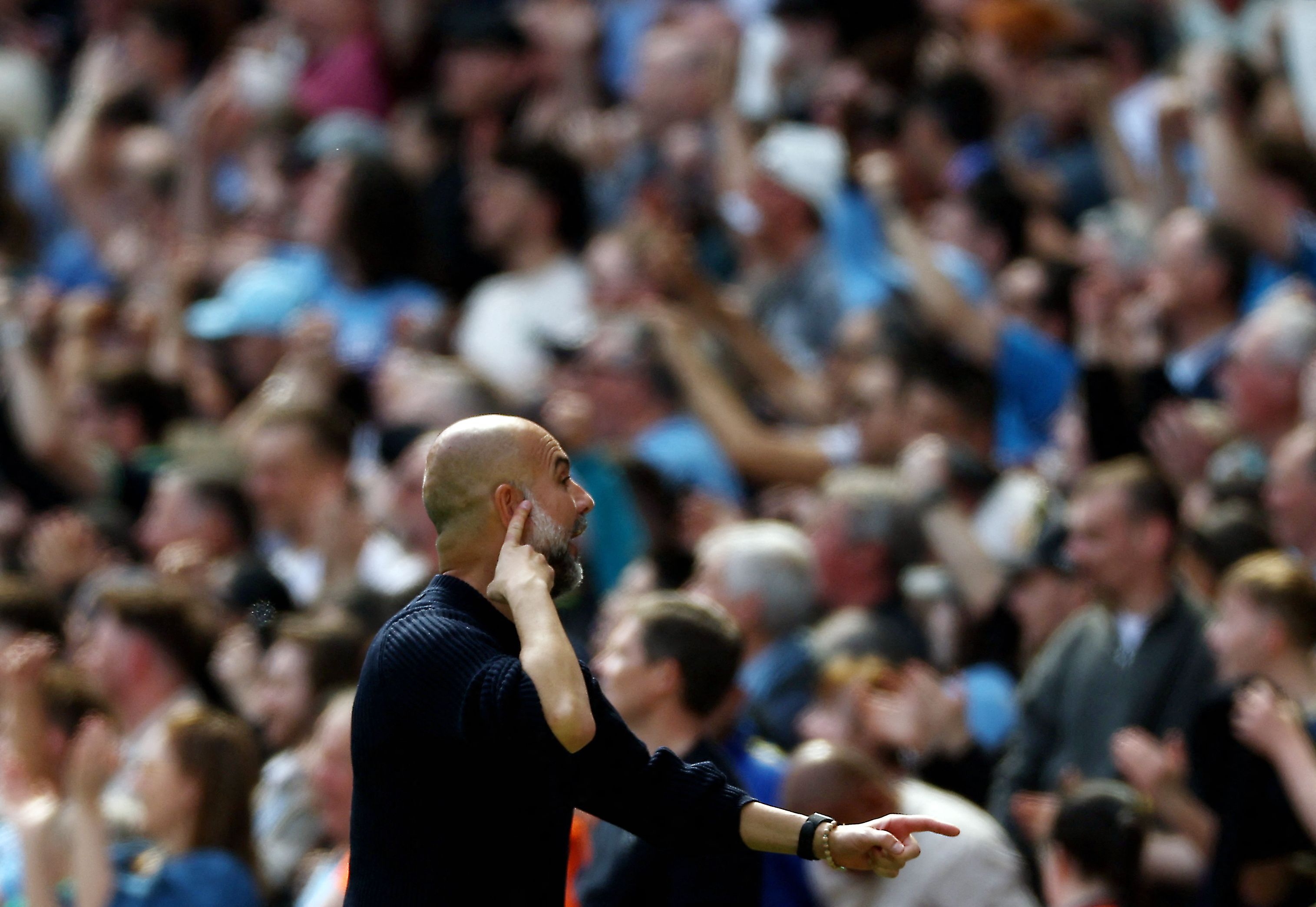 Premier League - Manchester City v Crystal Palace - Etihad Stadium, Manchester, Britain - April 12, 2025 Manchester City manager Pep Guardiola reacts towards fans