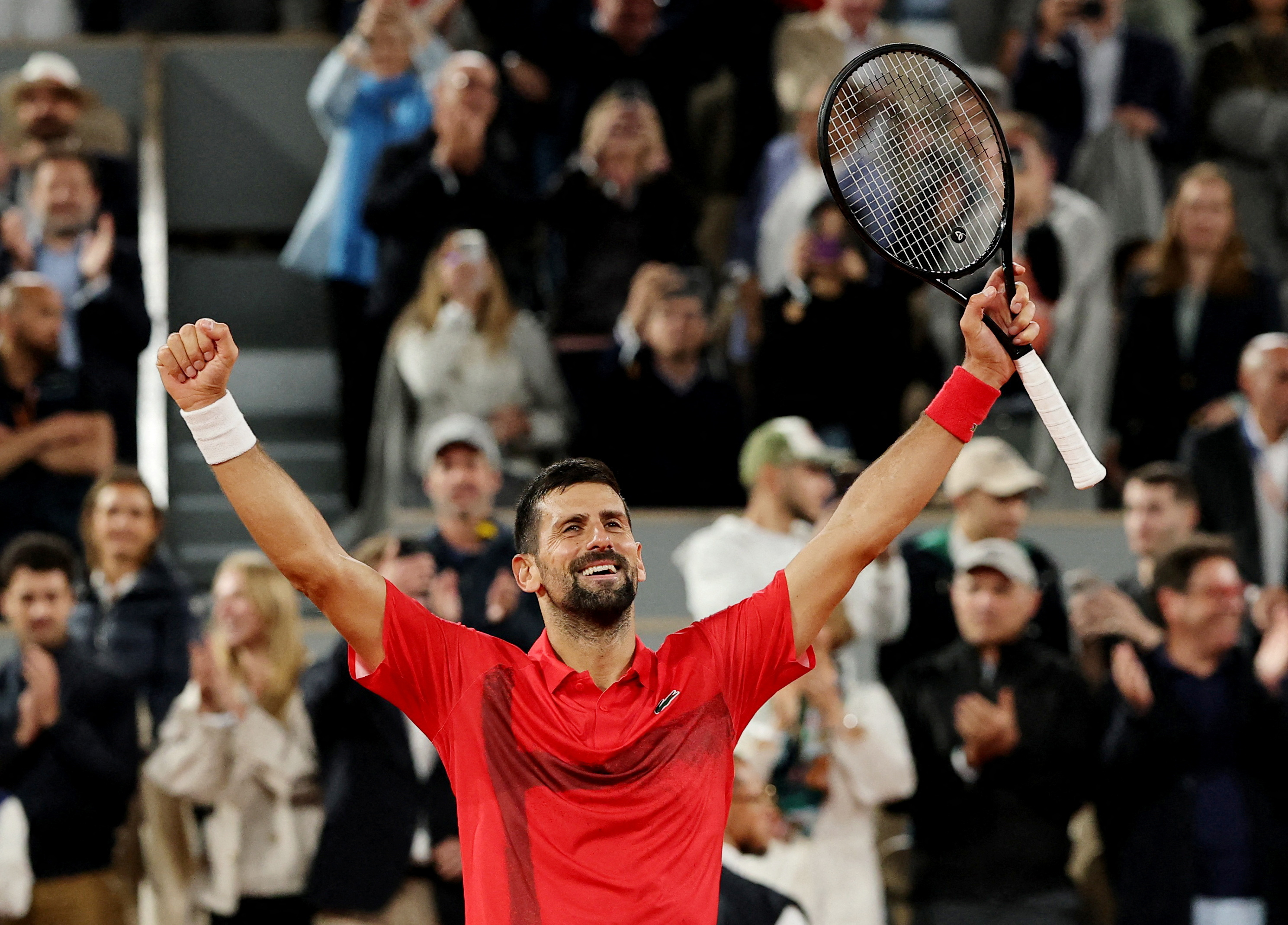 Serbia's Novak Djokovic celebrates after winning his quarter final match against Germany's Alexander Zverev