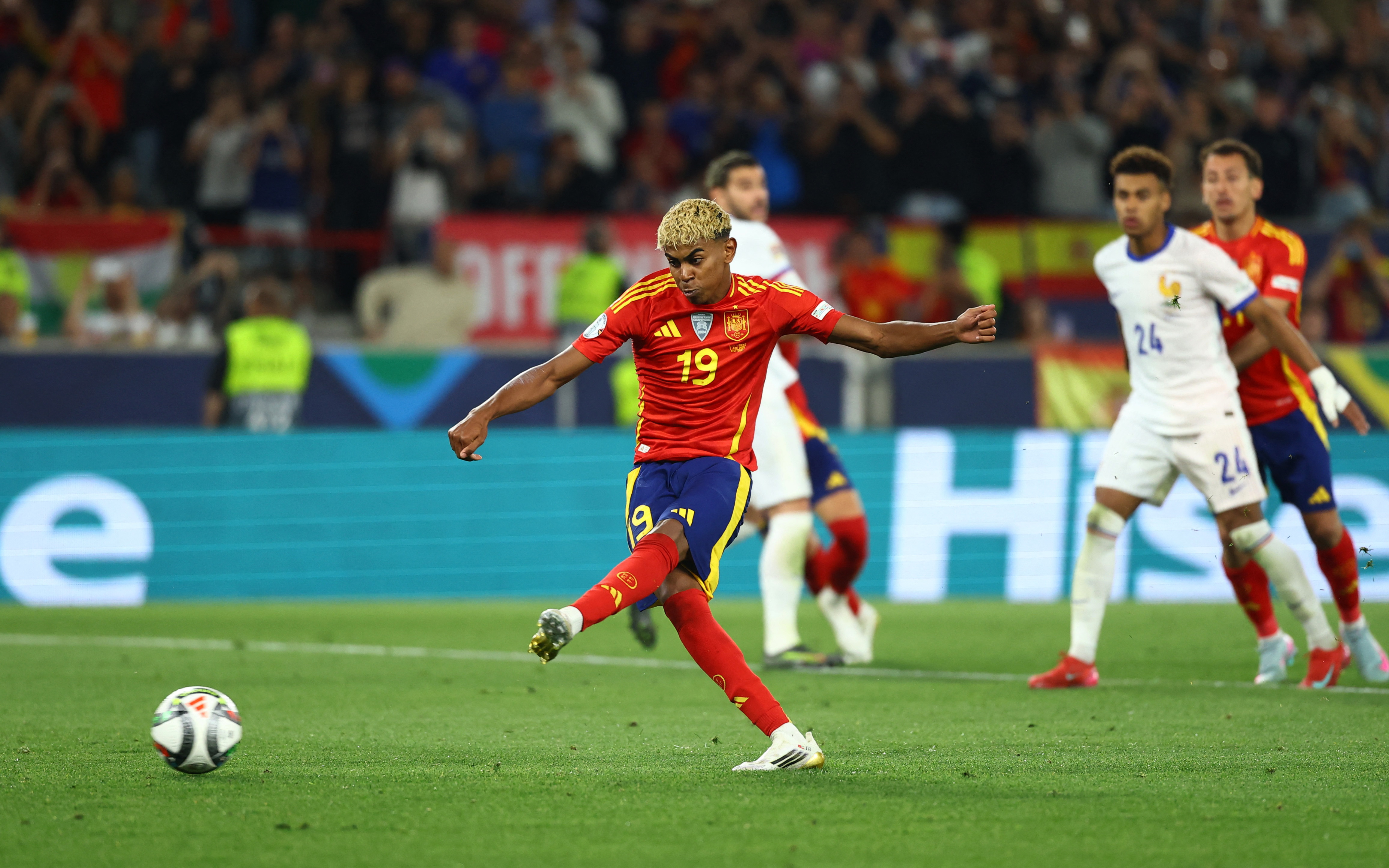 Spain's Lamine Yamal scores their third goal from the penalty spot