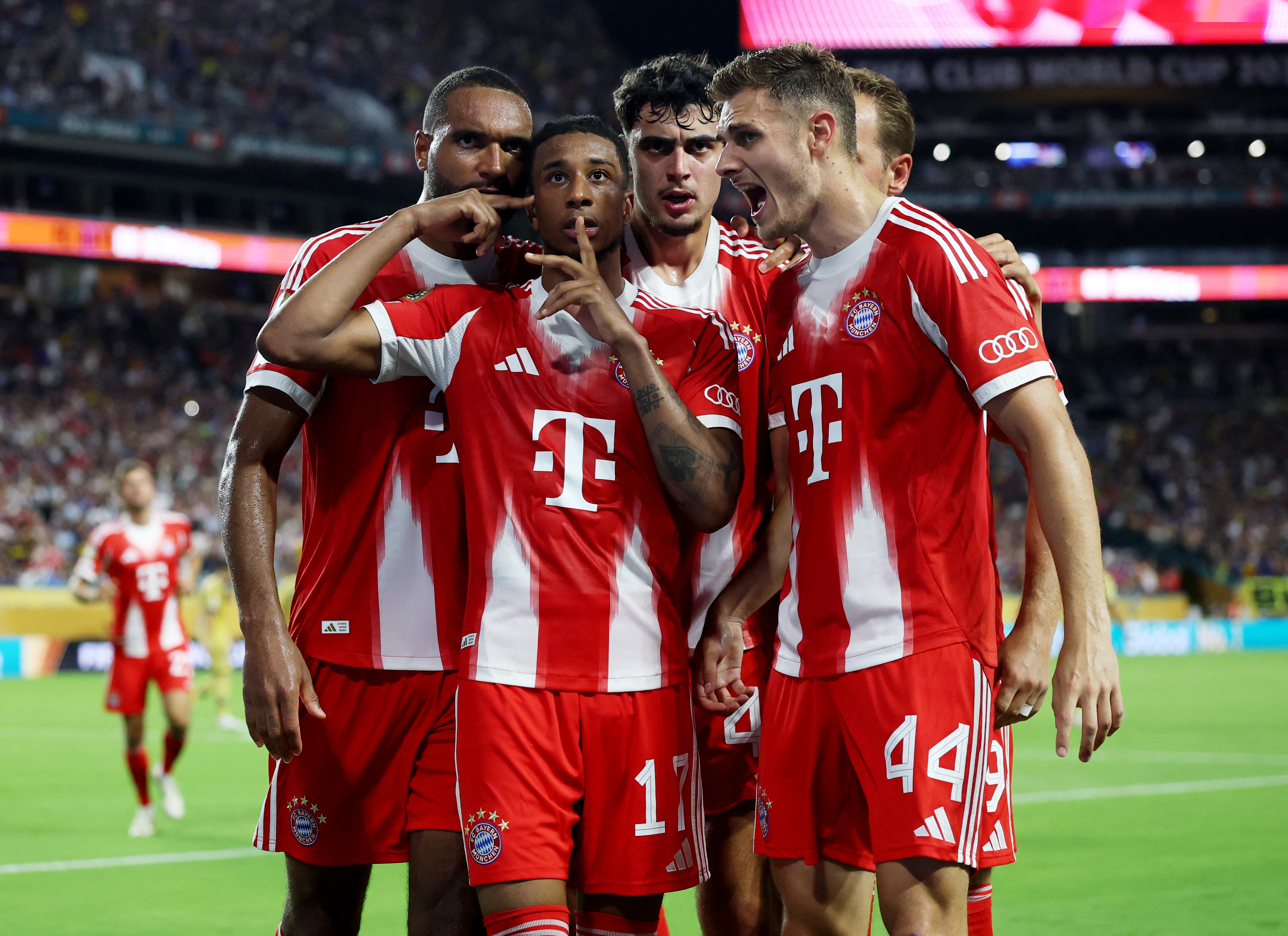 Bayern Munich's Michael Olise celebrates scoring their second goal with teammates