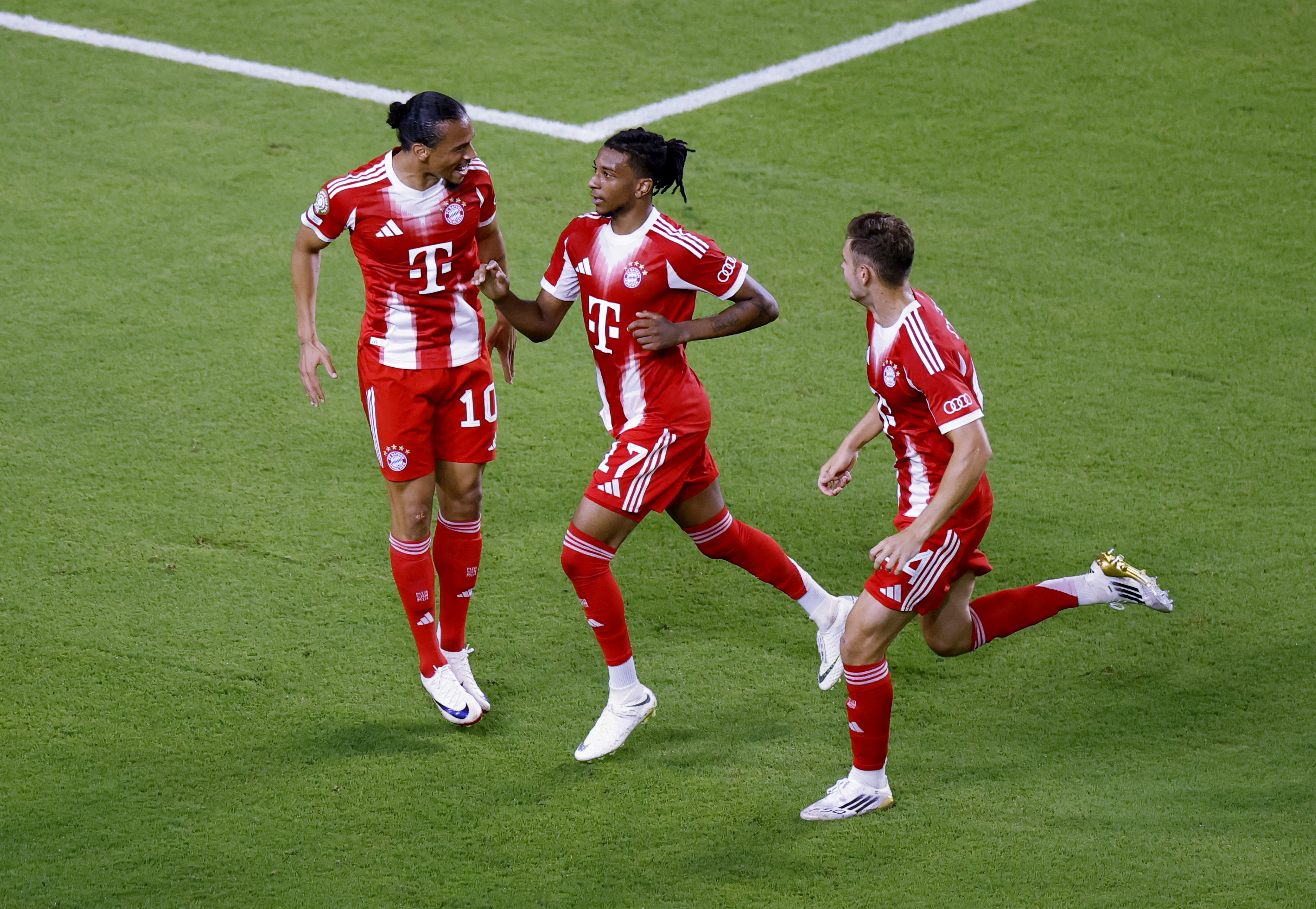 Bayern Munich's Michael Olise celebrates scoring their second goal