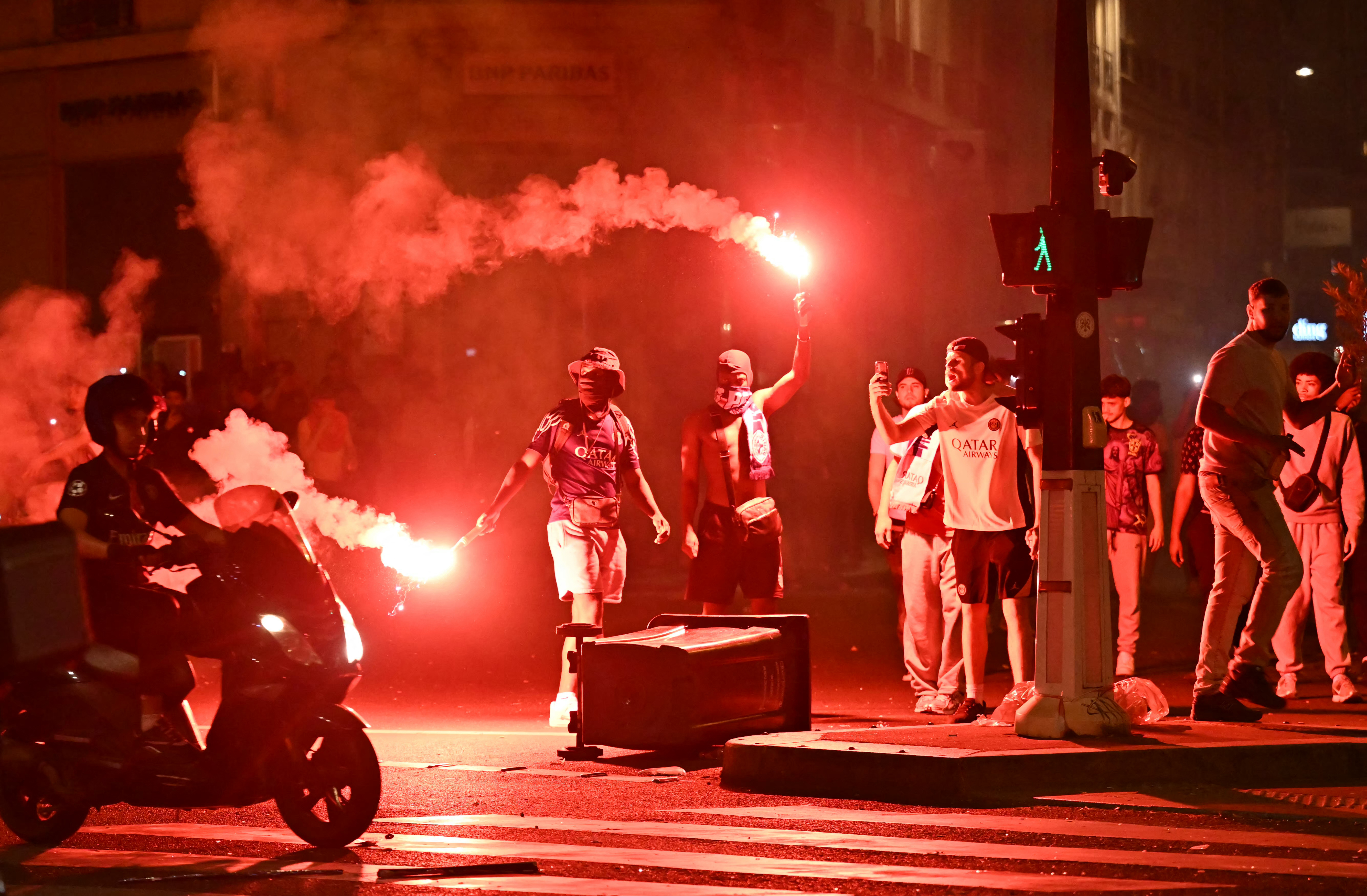 Football fans with flares.