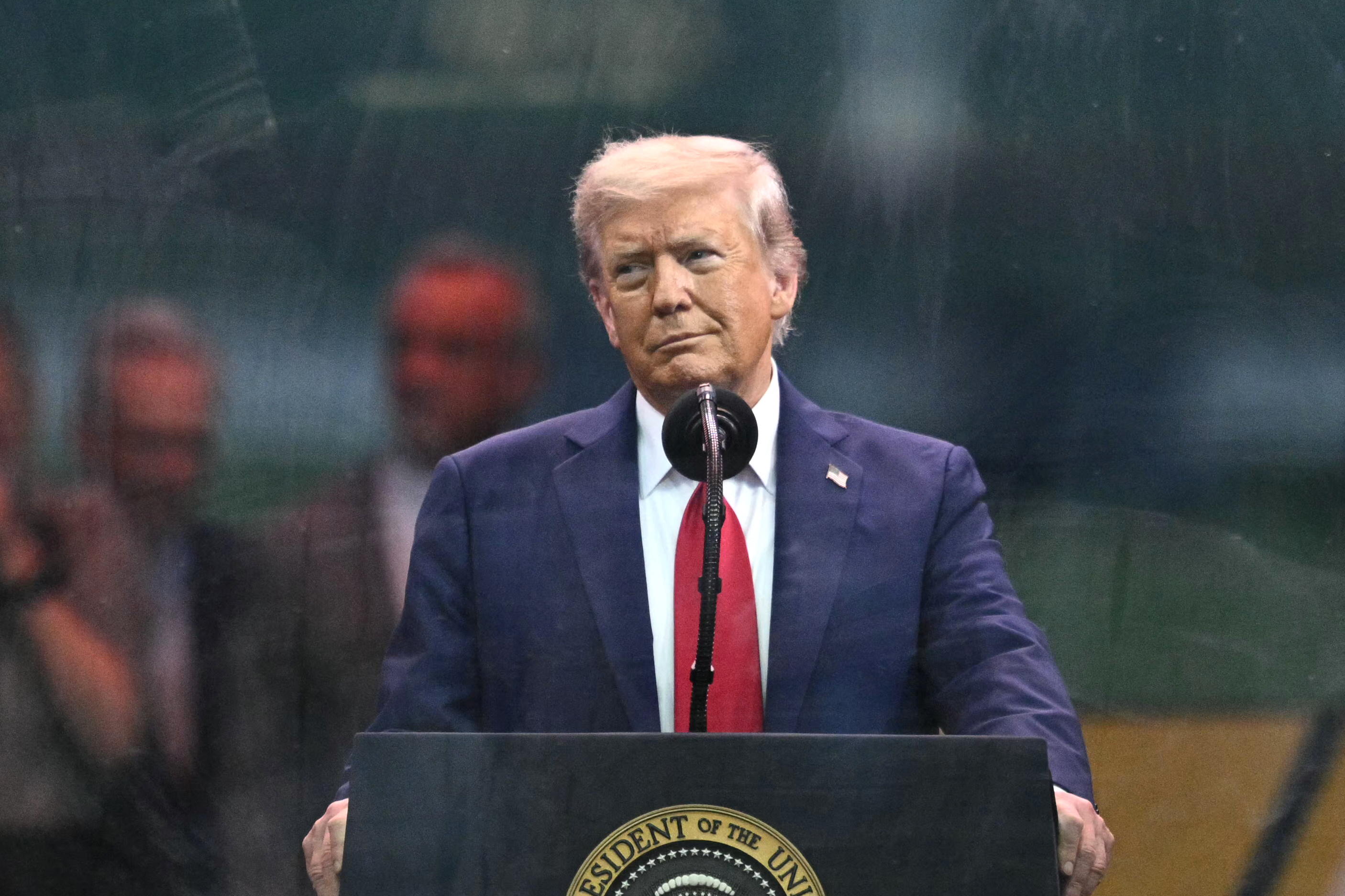US President Donald Trump speaks during the Army 250th Anniversary Parade from the Ellipse in Washington, DC on June 14, 2025. US President Donald Trump reveled in a long dreamt-of military parade on his 79th birthday Saturday, as demonstrators across the country branded him a dictator in the biggest protests since his return to power. (Photo by Mandel NGAN / AFP)