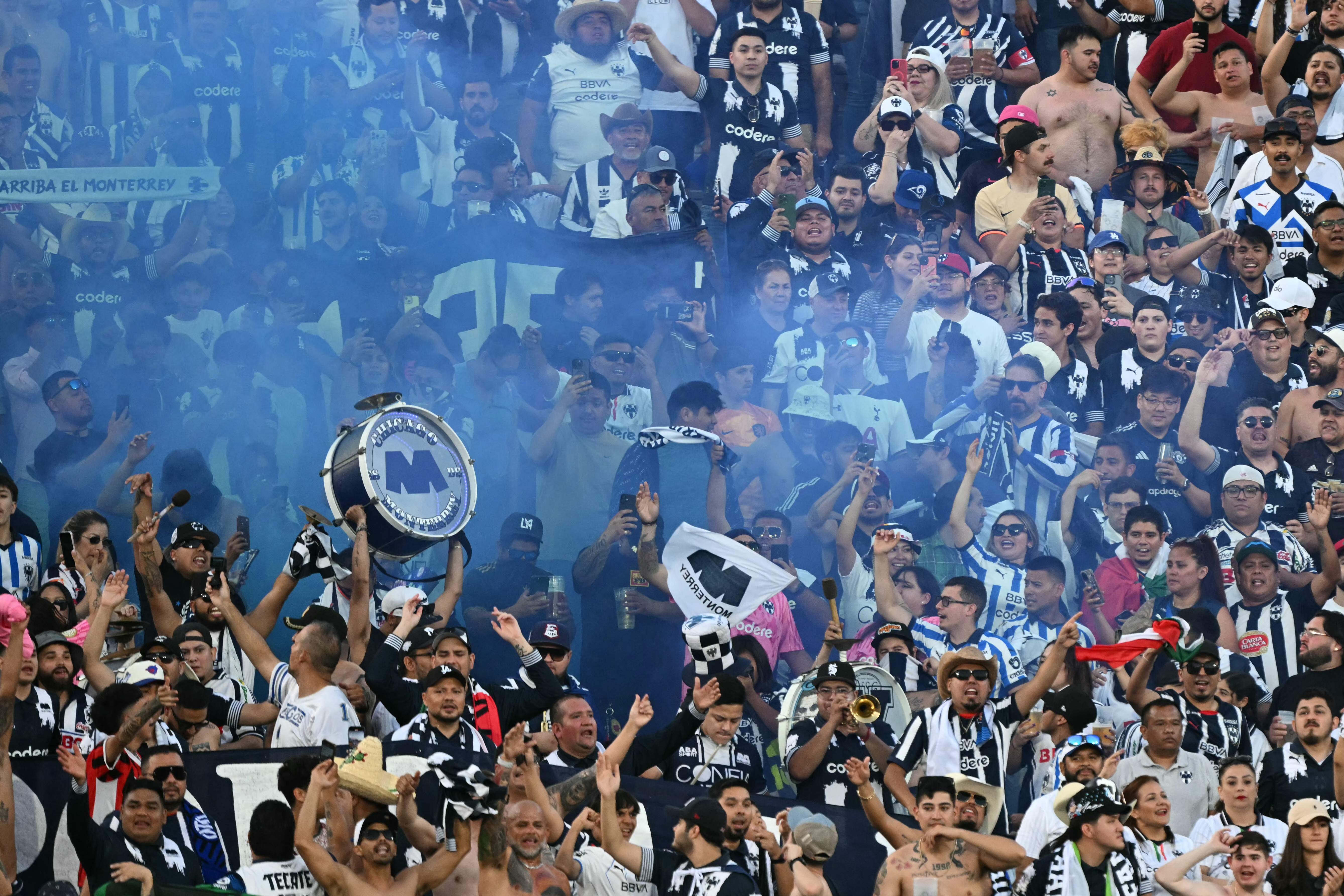 Fans of Monterrey cheer for their team during the FIFA Club World Cup 2025 Group E football match between Mexico's Monterrey and Italy's Inter Milan at the Rose Bowl stadium in Pasadena on June 17, 2025. (Photo by YURI CORTEZ / AFP)