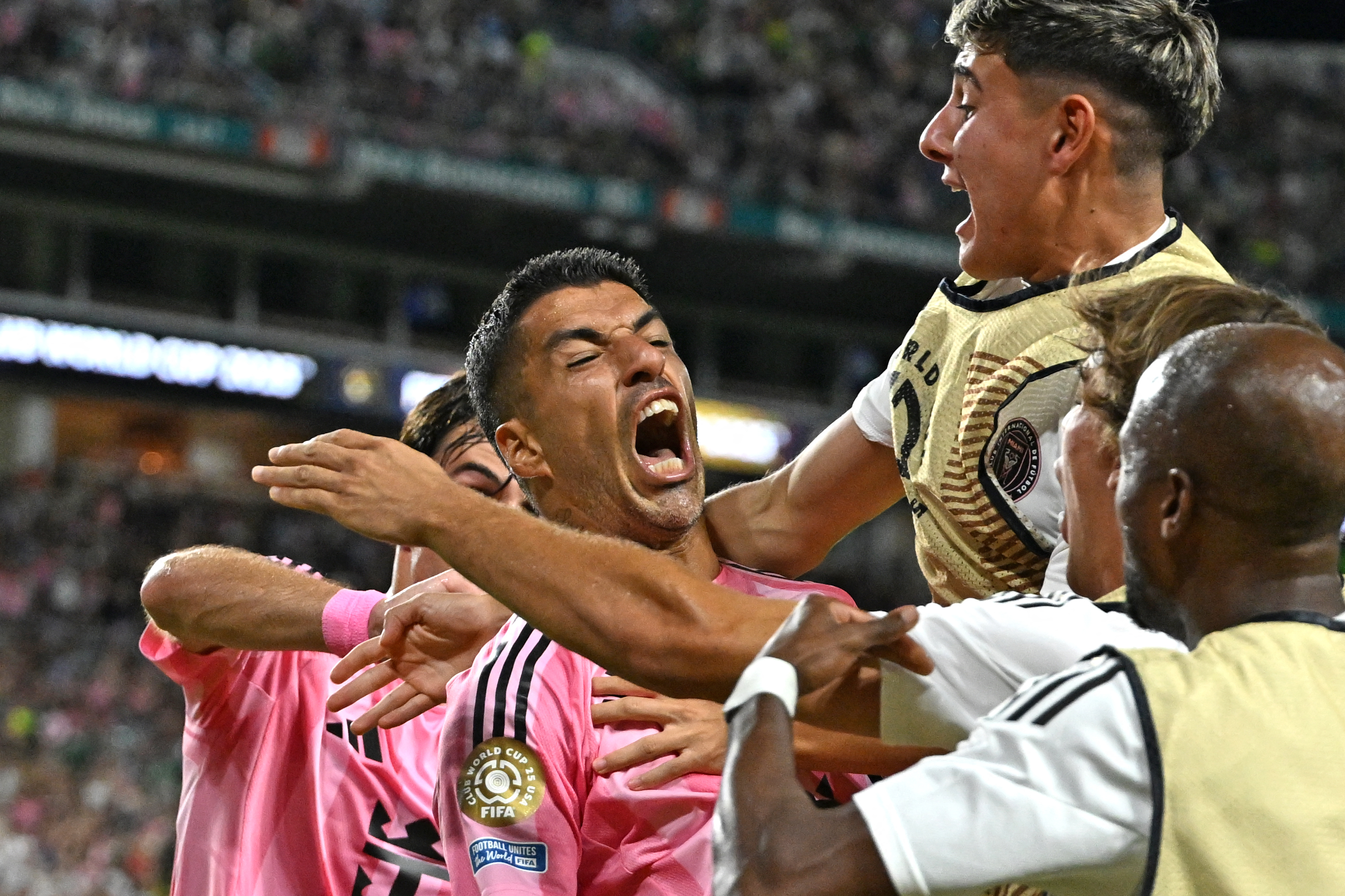Inter Miami's Uruguayan forward #09 Luis Suarez (C) celebrates scoring his team's second goal during the FIFA Club World Cup 2025 Group A football match between US Inter Miami and Brazil's Palmeiras at the Hard Rock stadium in Miami on June 23, 2025. (Photo by PATRICIA DE MELO MOREIRA / AFP)
