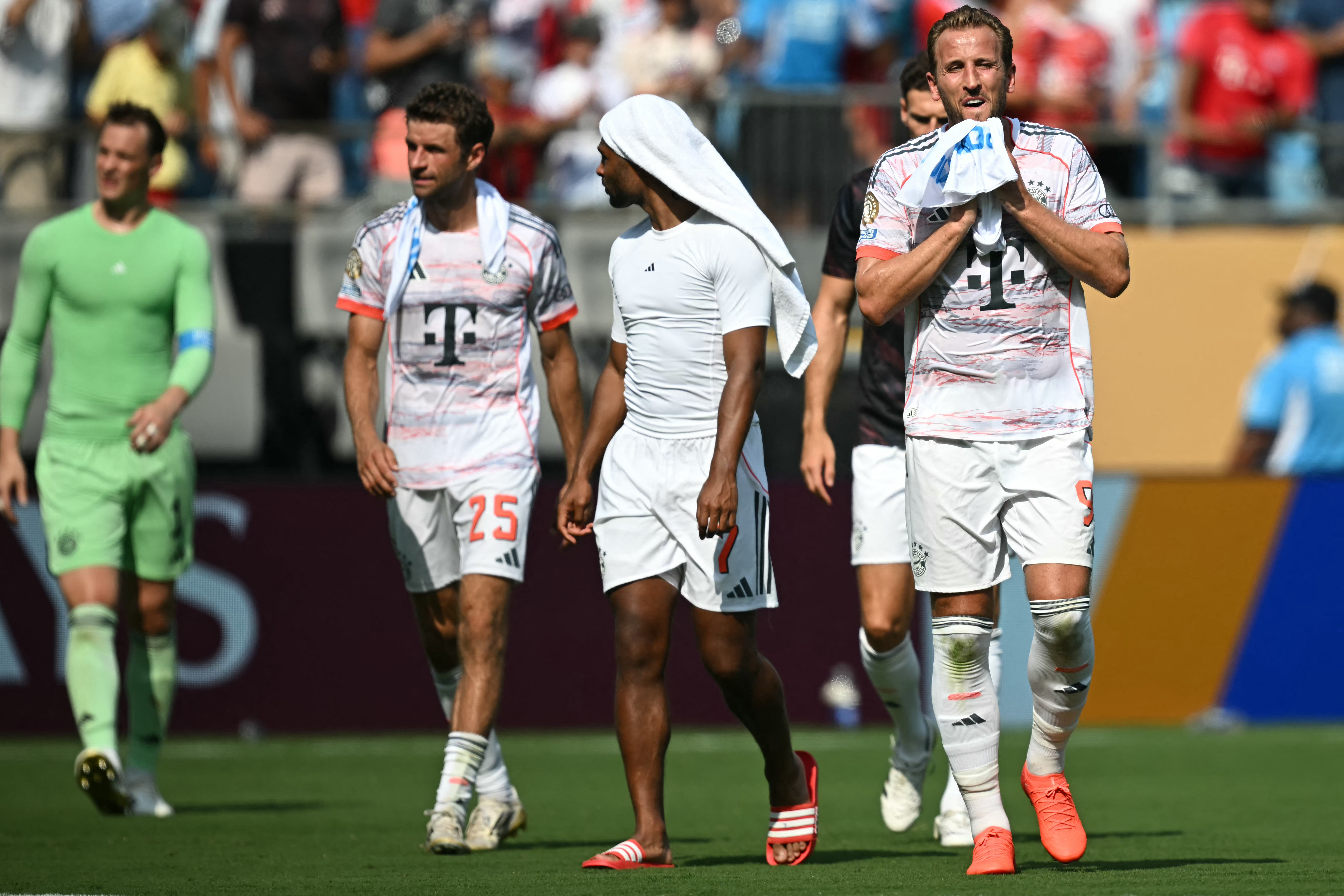 Bayern Munich's English forward #09 Harry Kane (R) reacts at the end of the FIFA Club World Cup 2025 Group C football match between Portugal's Benfica and Germany's Bayern Munich at the Bank of America stadium in Charlotte on June 24, 2025. (Photo by Paul ELLIS / AFP)