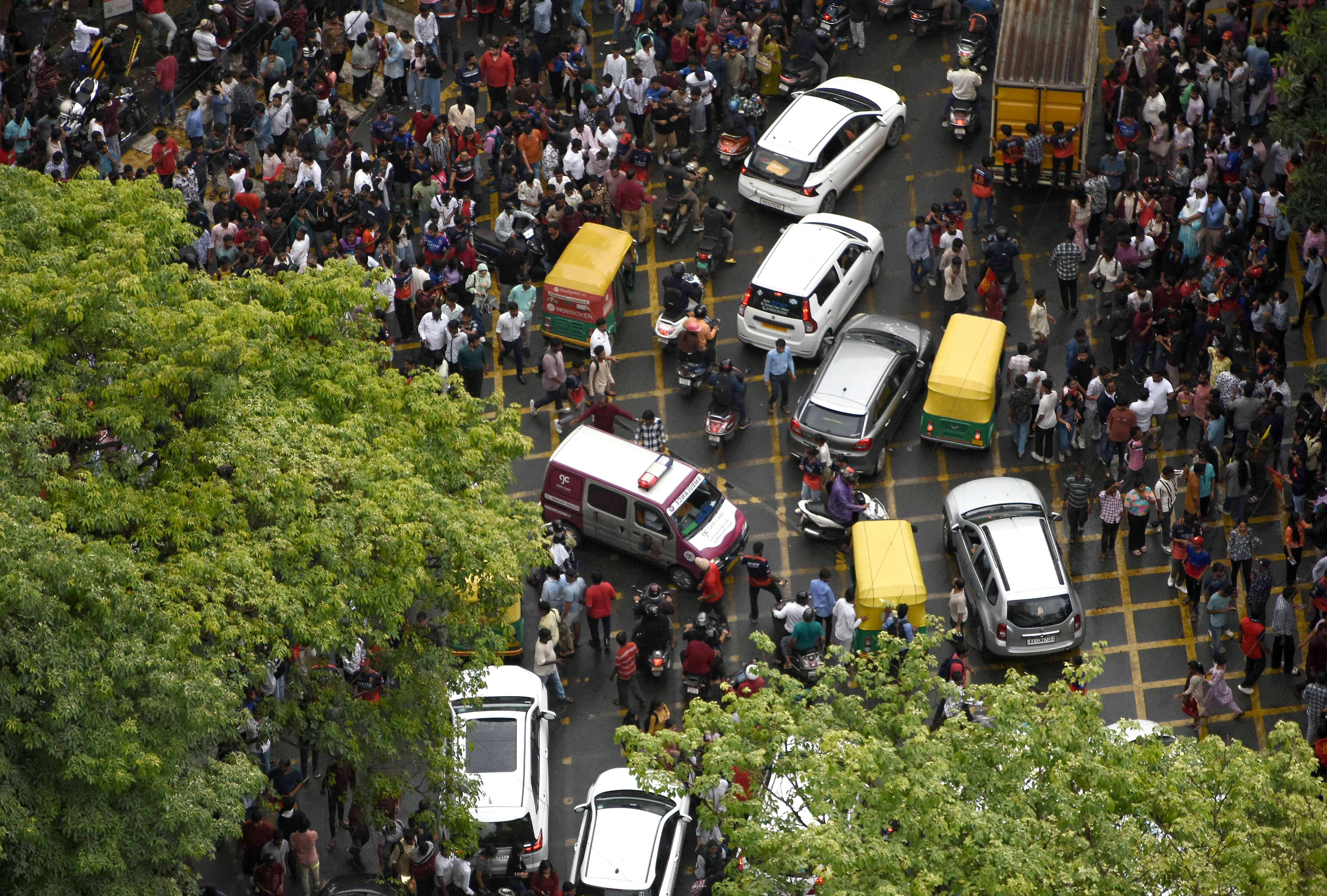 An ambulance moves following the stampede outside the cricket stadium in Bengaluru on June 4 [Reuters]