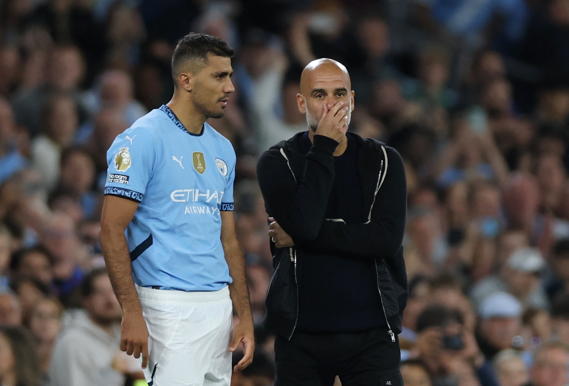 Manchester City's Rodri with manager Pep Guardiola
