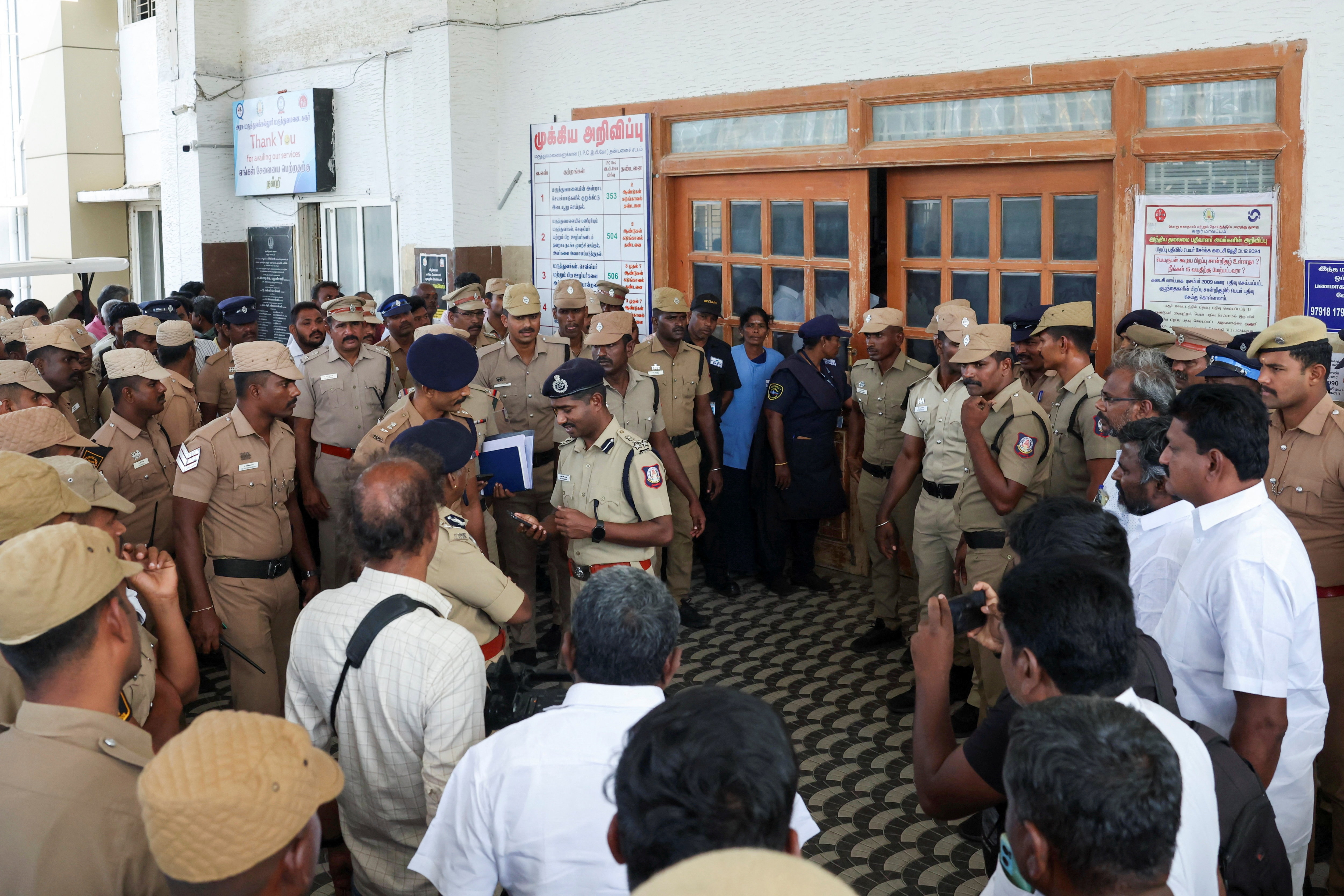 Relatives of people who were killed in a stampede during a rally for a popular Indian actor and politician, mourn outside a hospital, in Karur, in the southern state of Tamil Nadu, Saturday, Sept. 27, 2025. (AP Photo)