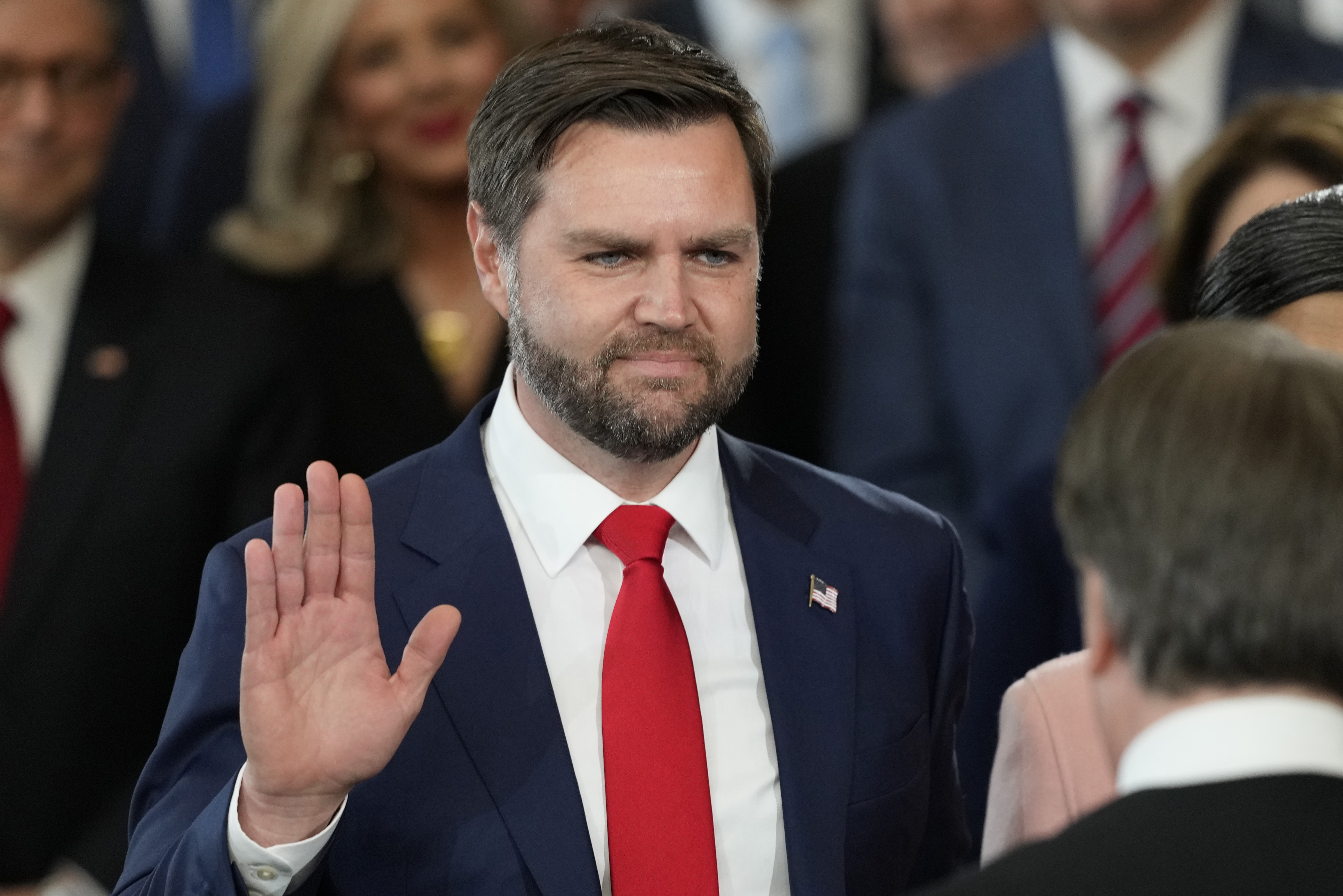 JD Vance raises his right hand for the swearing-in