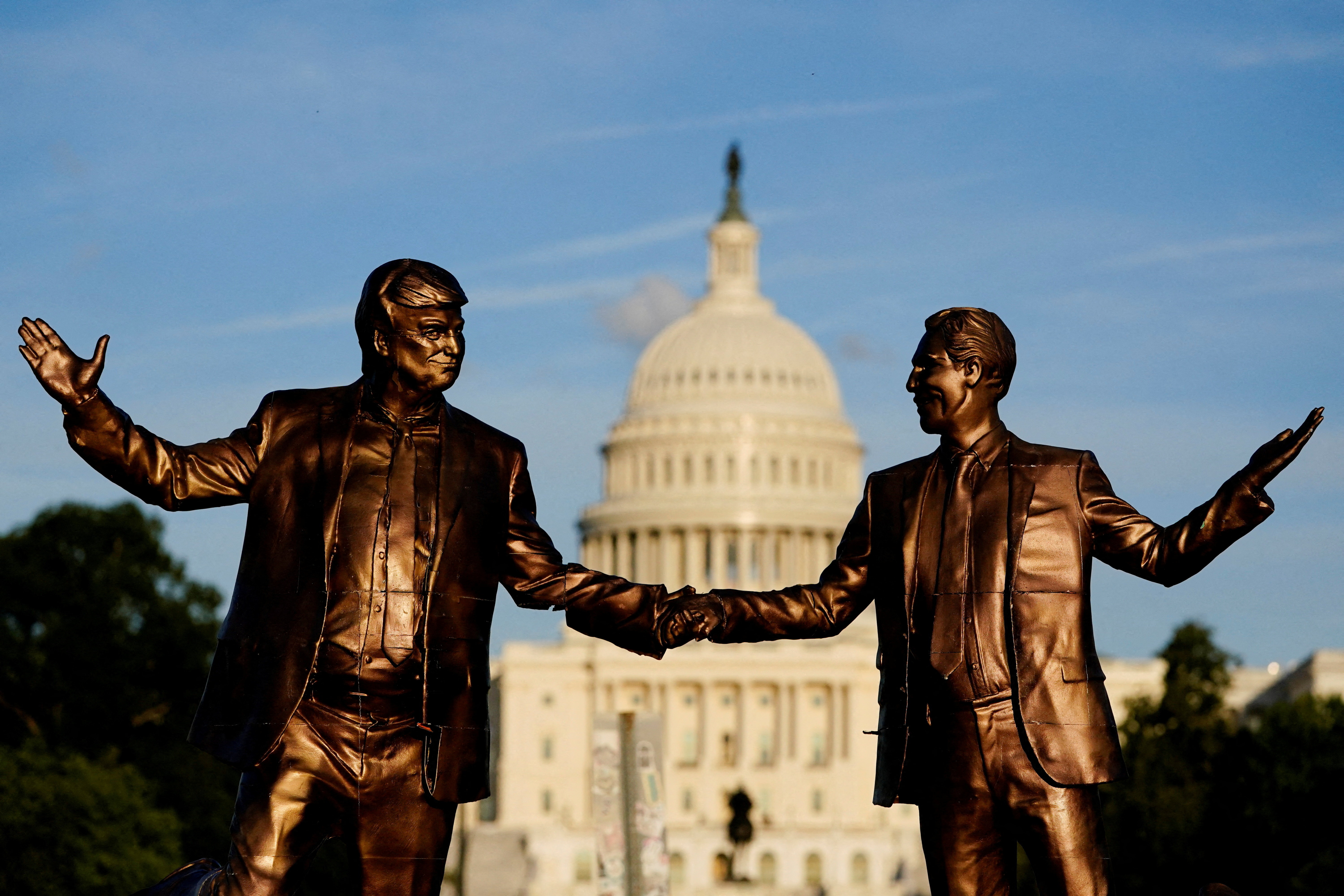 A view of a statue depicting US President Donald Trump and disgraced financier and sex offender Jeffrey Epstein holding hands.