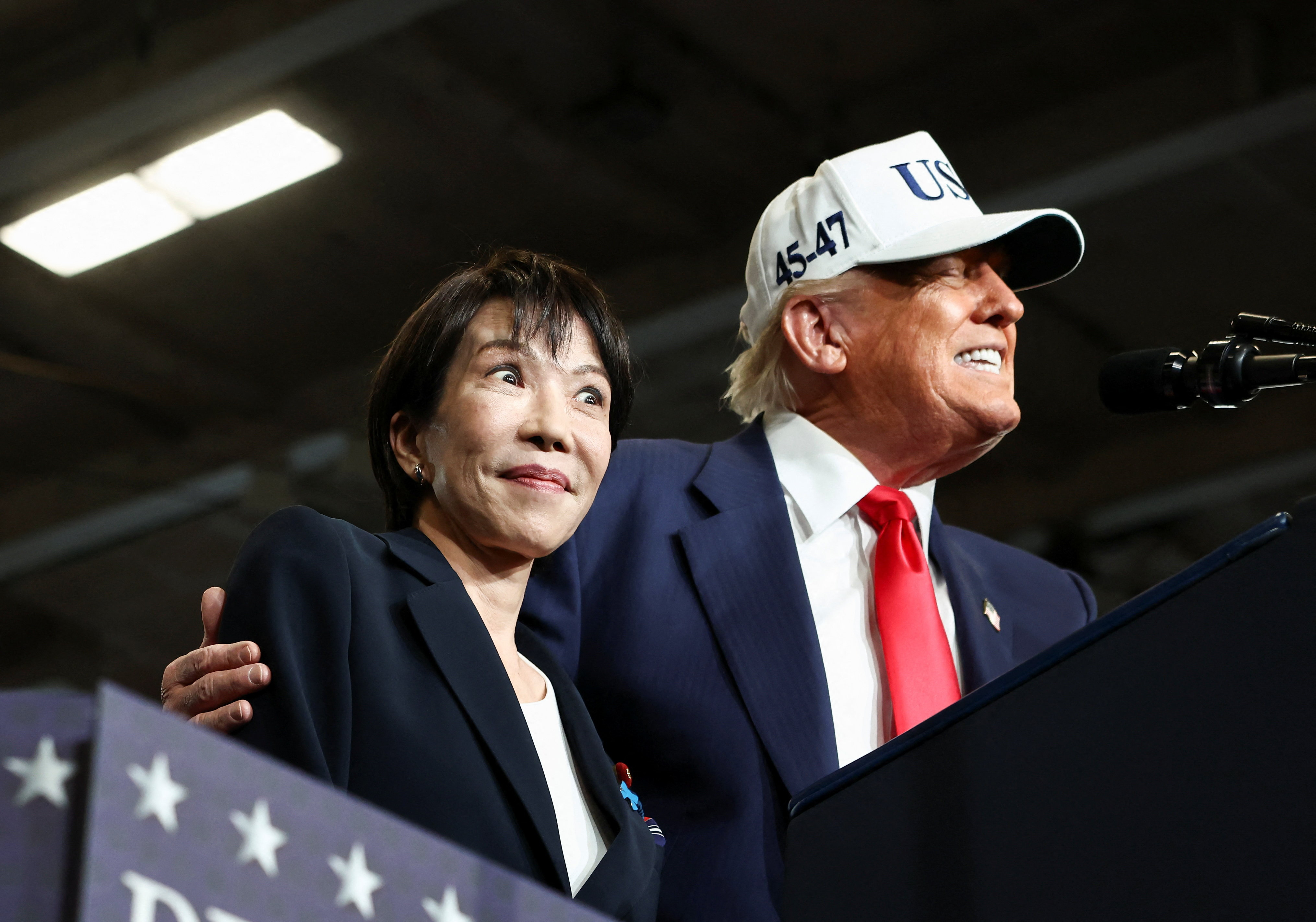 Trump poses for a photo with Sanae Takaichi