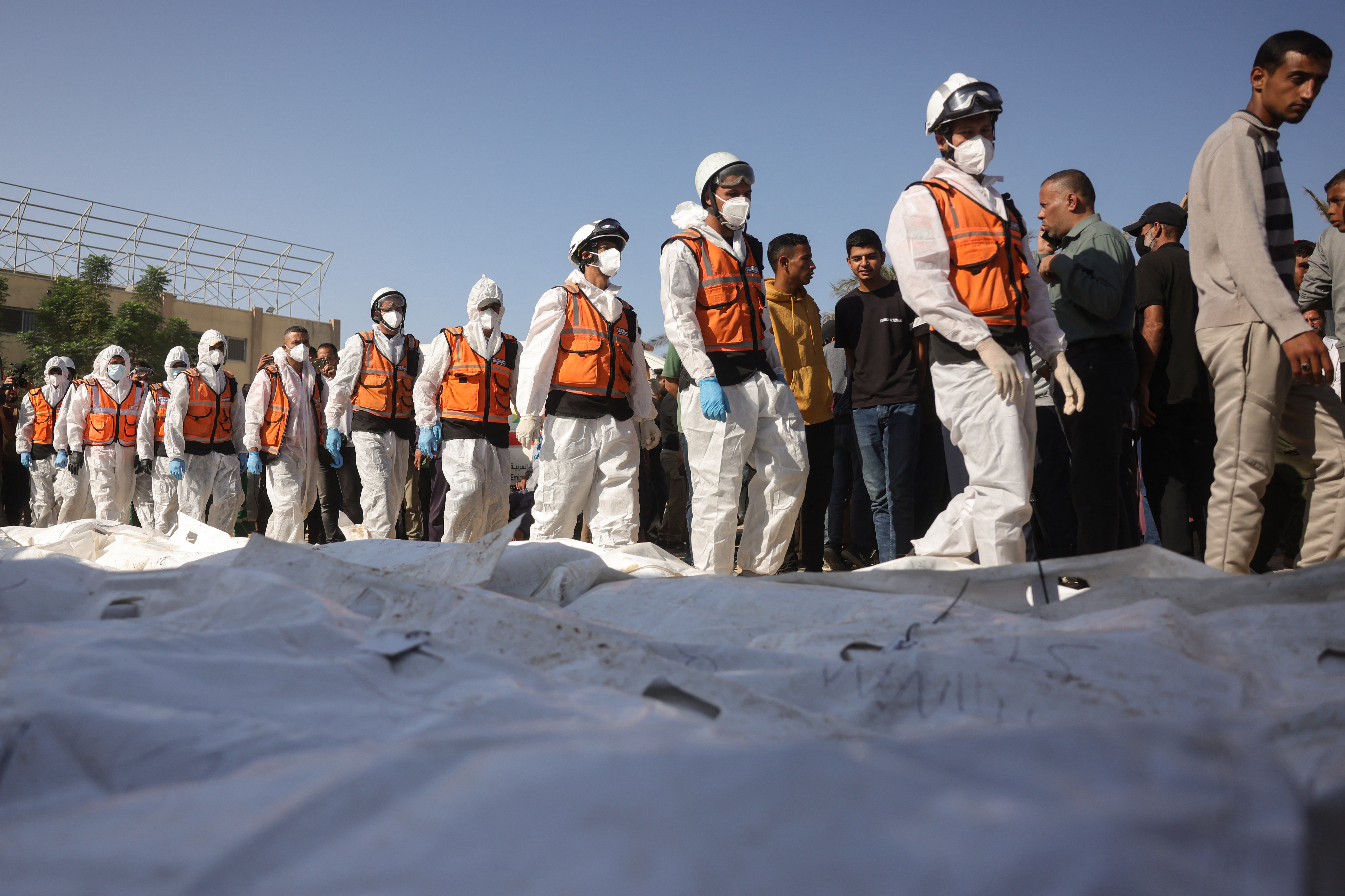 Families mourn as mass burial held for unidentified Palestinians in Gaza