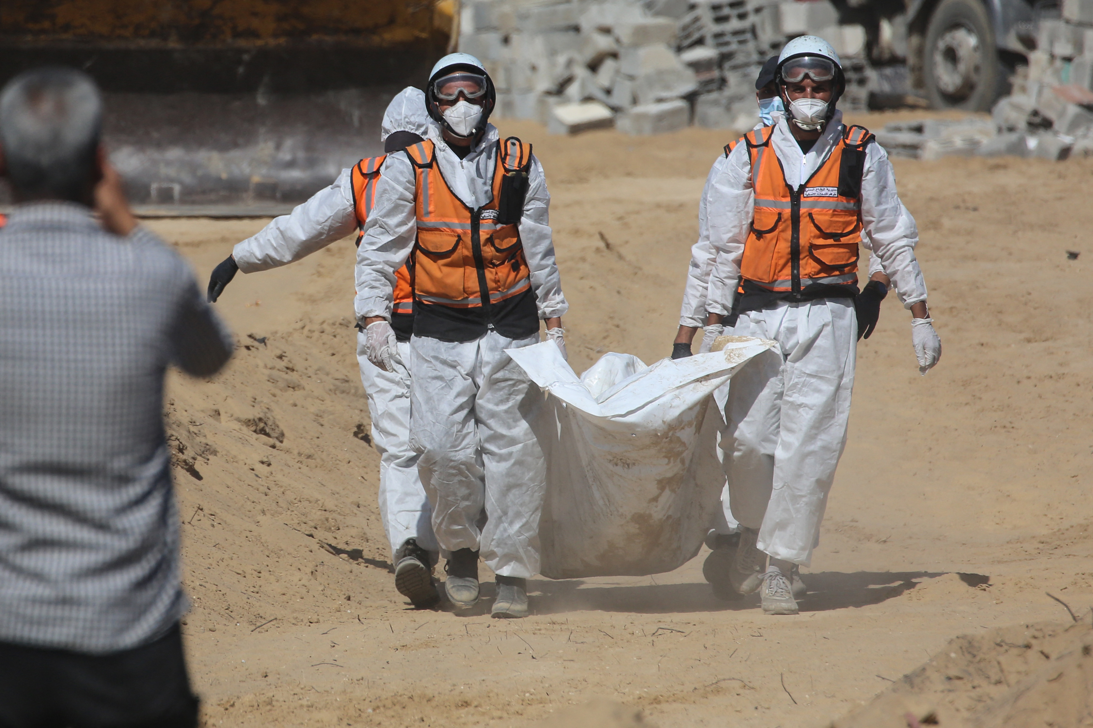 Families mourn as mass burial held for unidentified Palestinians in Gaza