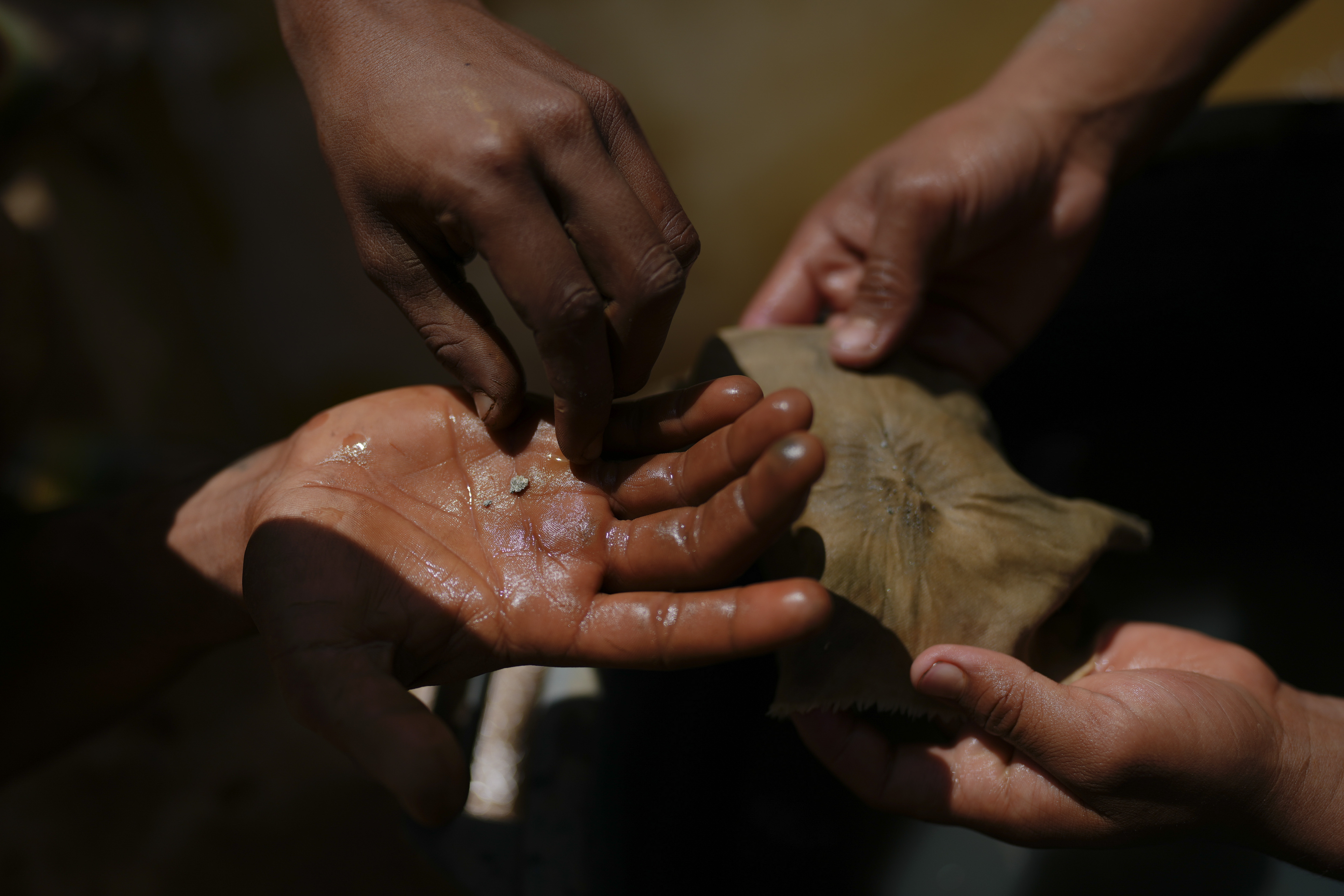 A miner holds amalgamated gold at a gold mine in El Callao, Bolivar state, Venezuela
