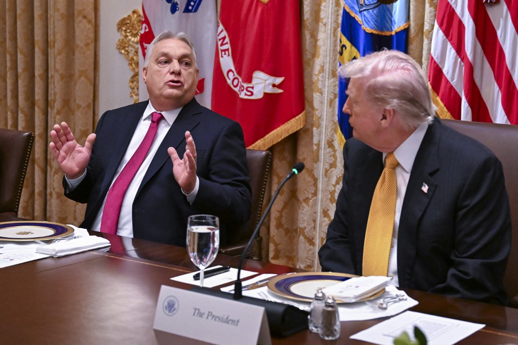 Hungary Prime Minister Viktor Orban interacts with US President Donald Trump during a bilateral lunch in the Cabinet Room of the White House on November 7, 2025 in Washington, DC. [File: Roberto Schmidt/Getty Images/AFP]