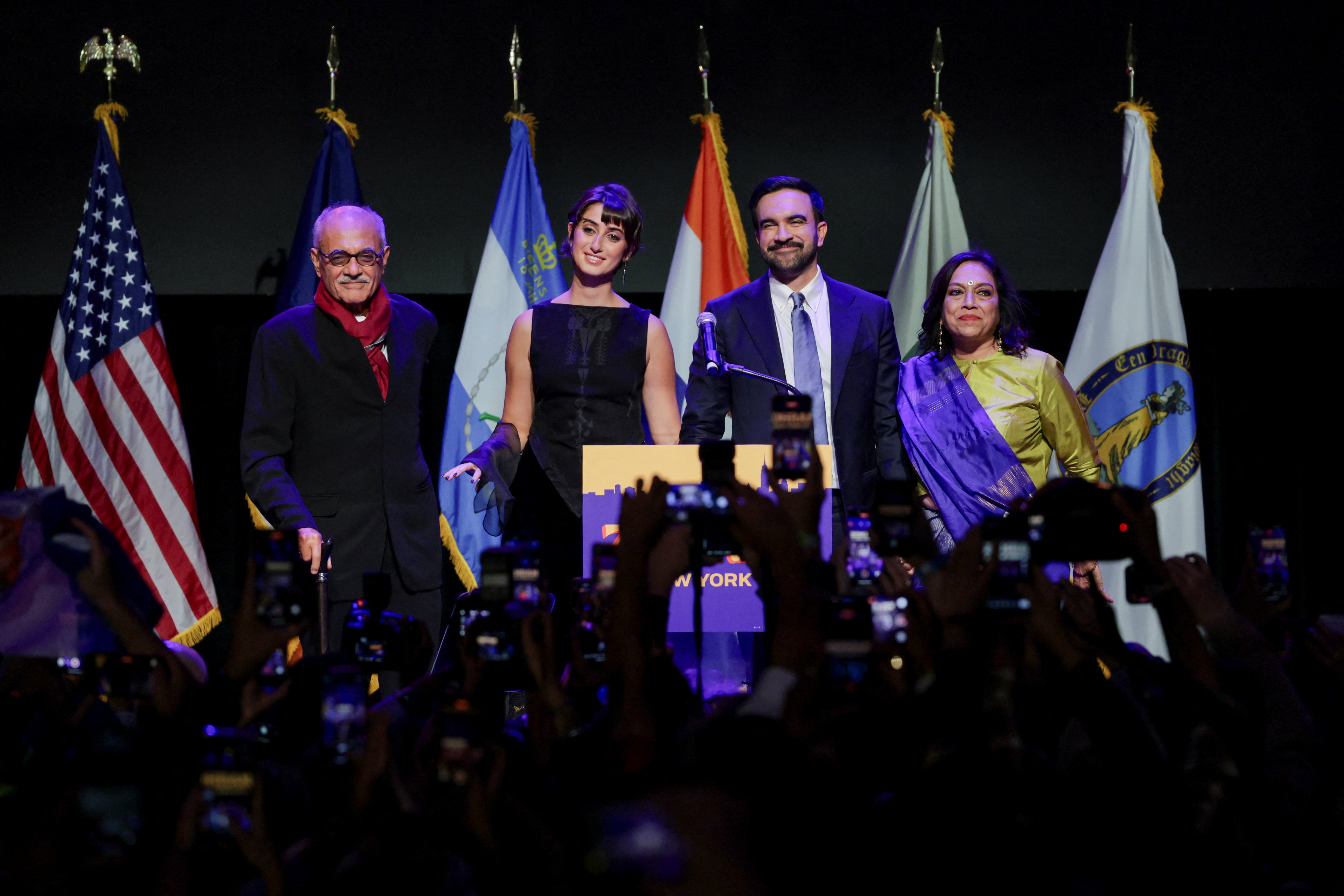 Democratic candidate Zohran Mamdani stands with his wife Rama Duwaji, mother Mira Nair and father Mahmood Mamdani after winning the 2025 New York City mayoral race