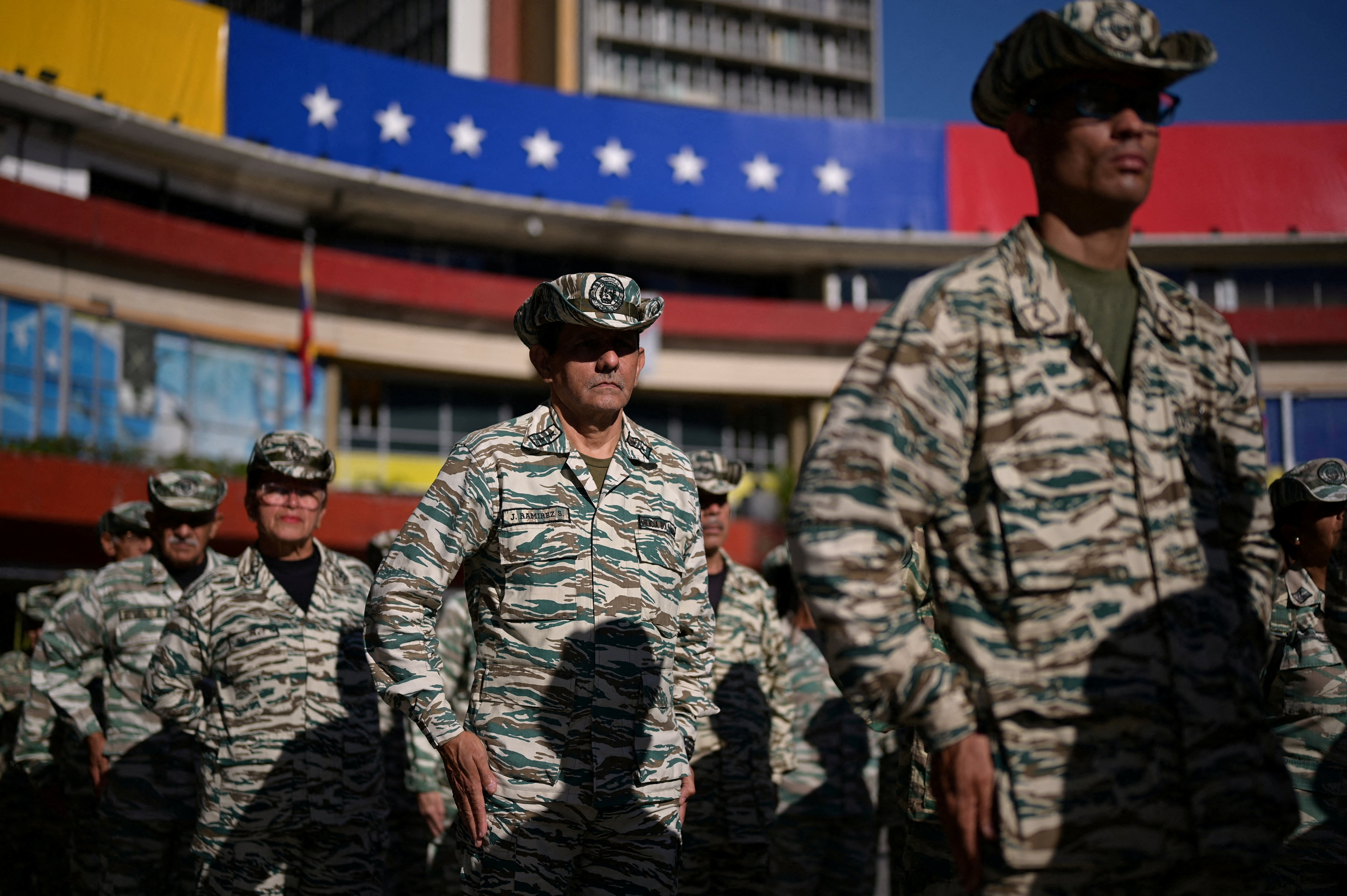 Members of the Bolivarian Militia stand in formation during military training in Caracas
