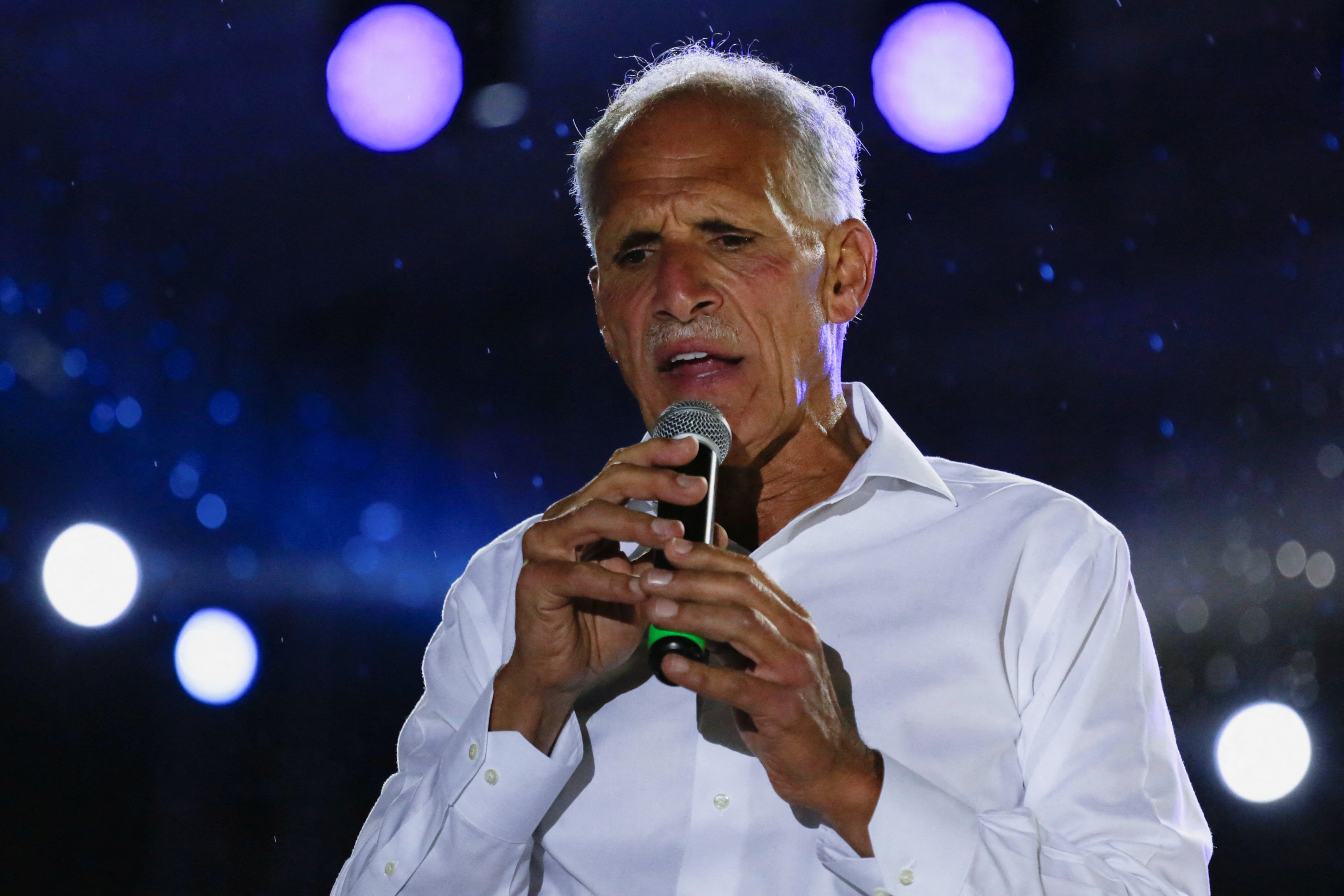 Nasry Asfura speaks into a mic