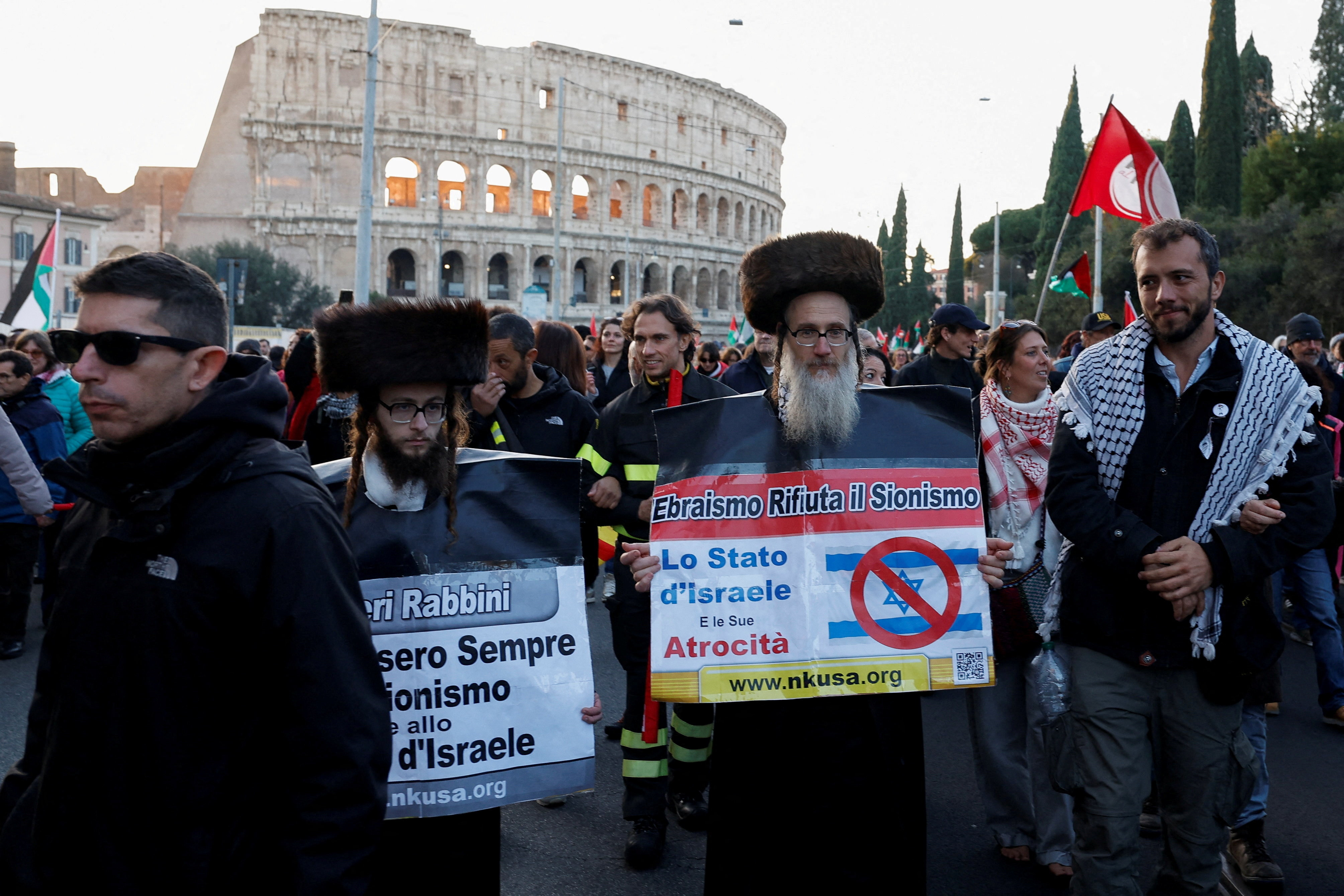 Brazilian activist Thiago Avila, a member of the Global Sumud Flotilla, walks with Ortodox Jews at a demonstration during a nationwide strike, called by the USB union, in solidarity with Gaza and against the government and its plan to increase military spending, in Rome, Italy
