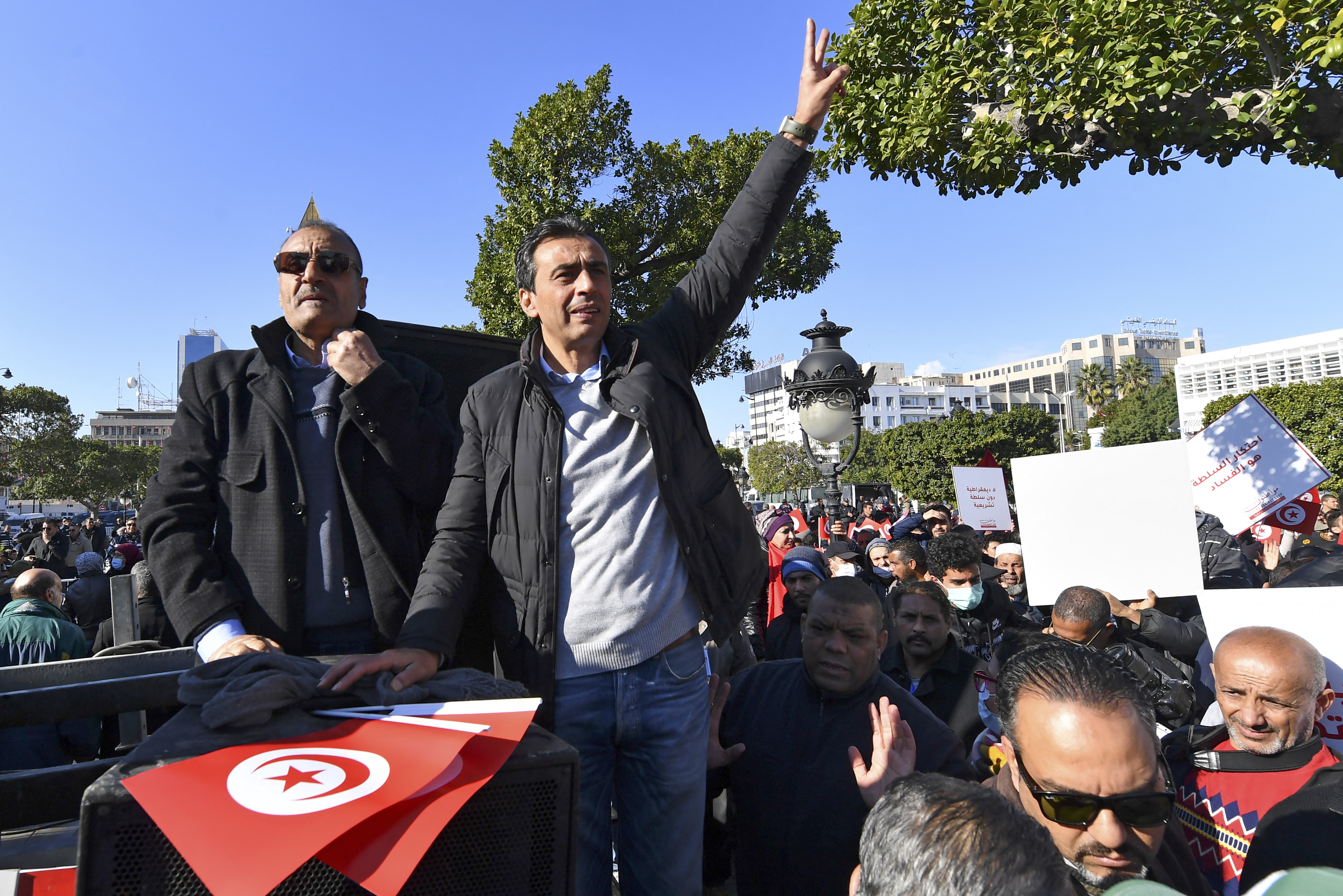 Jawhar Ben Mbarek waves during a demonstration.