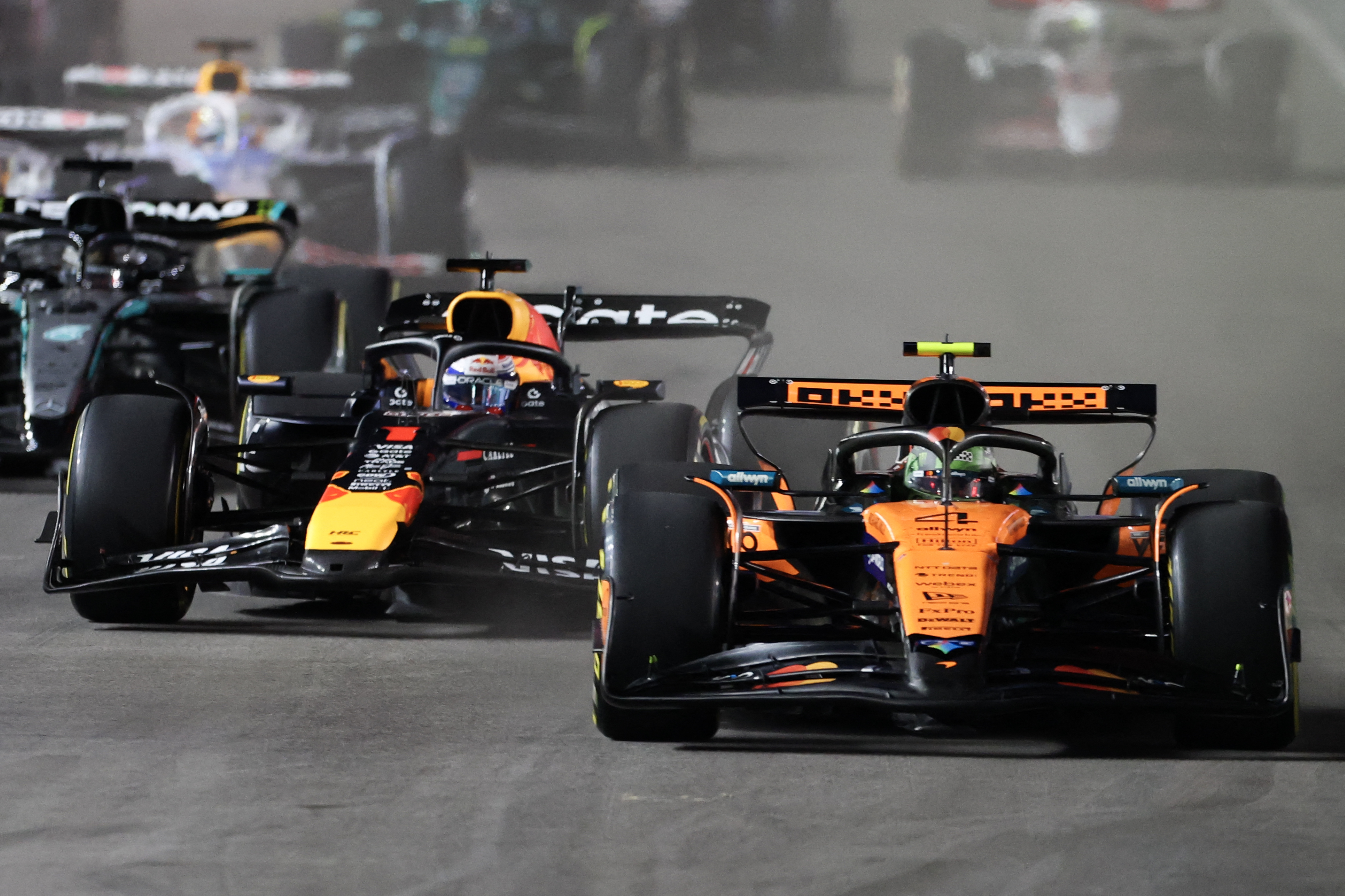 McLaren’s Lando Norris, right, and Red Bull Racing’s Max Verstappen race at the start of the Las Vegas Formula One Grand Prix