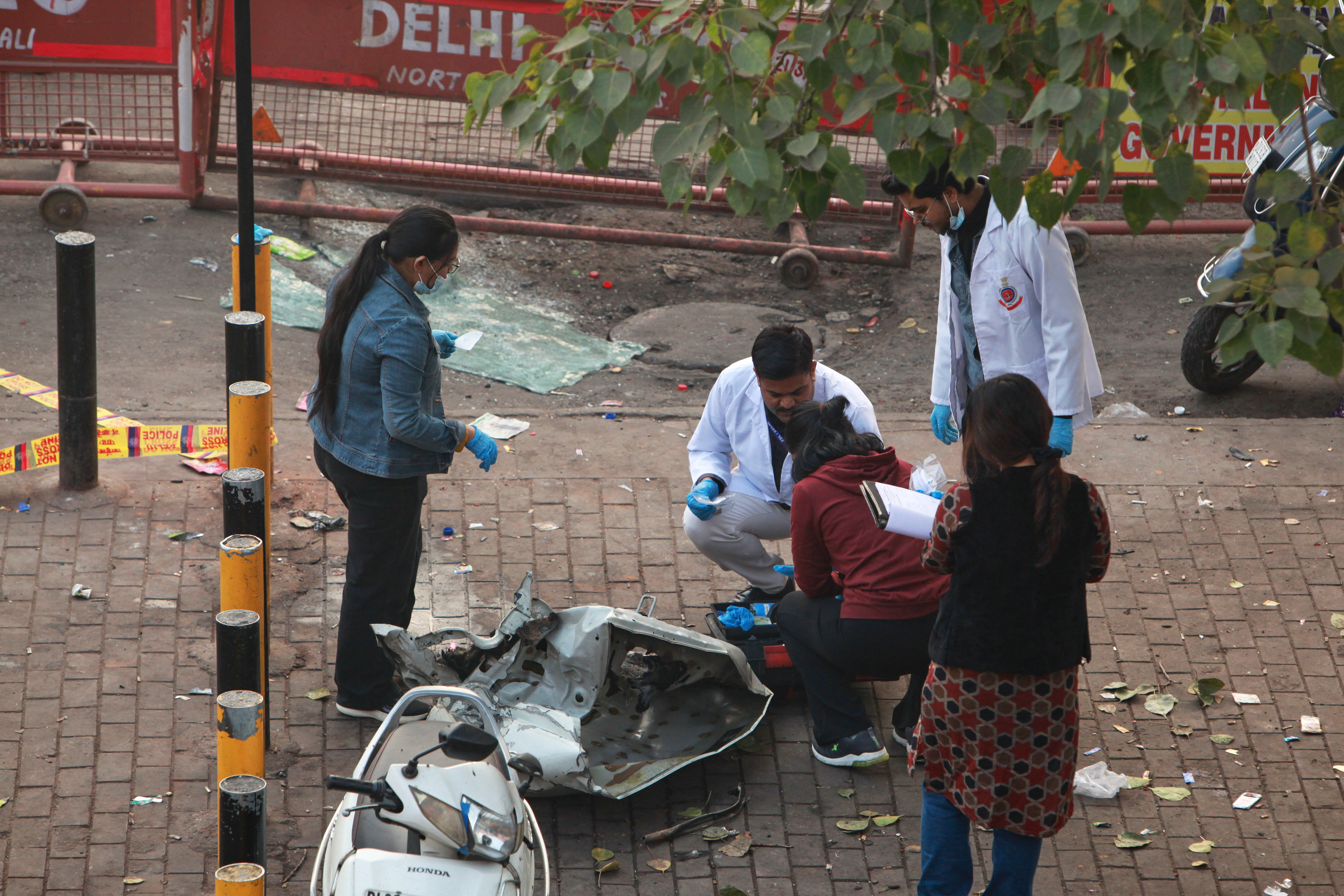 Investigators examine the site of Monday's car explosion near the historic Red Fort, in New Delhi, India, Tuesday, Nov. 11, 2025. (AP Photo)