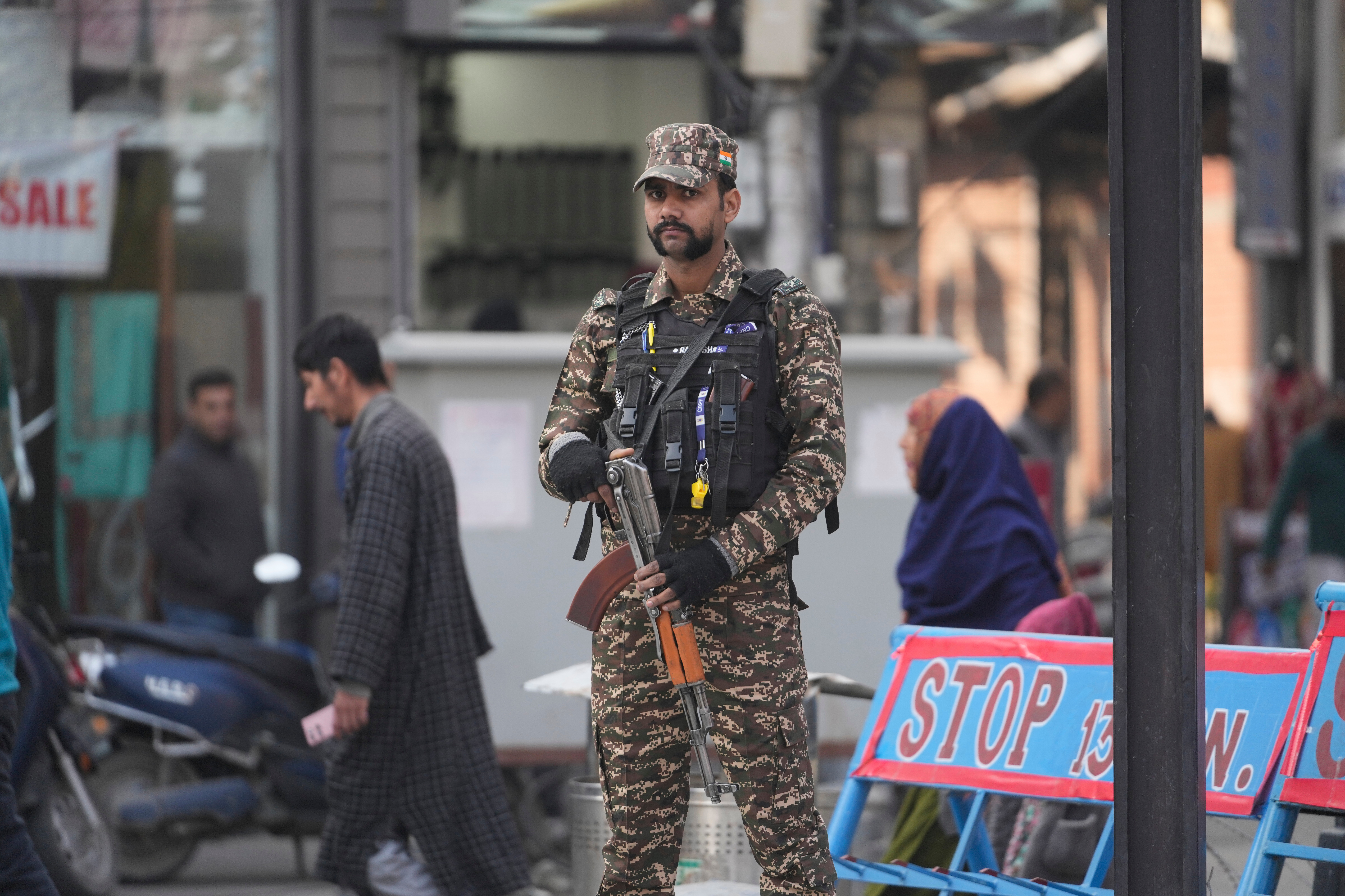 An Indian soldier stands guard in Srinagar, Indian controlled Kashmir, Wednesday, Nov. 12, 2025. (AP Photo/Mukhtar Khan)