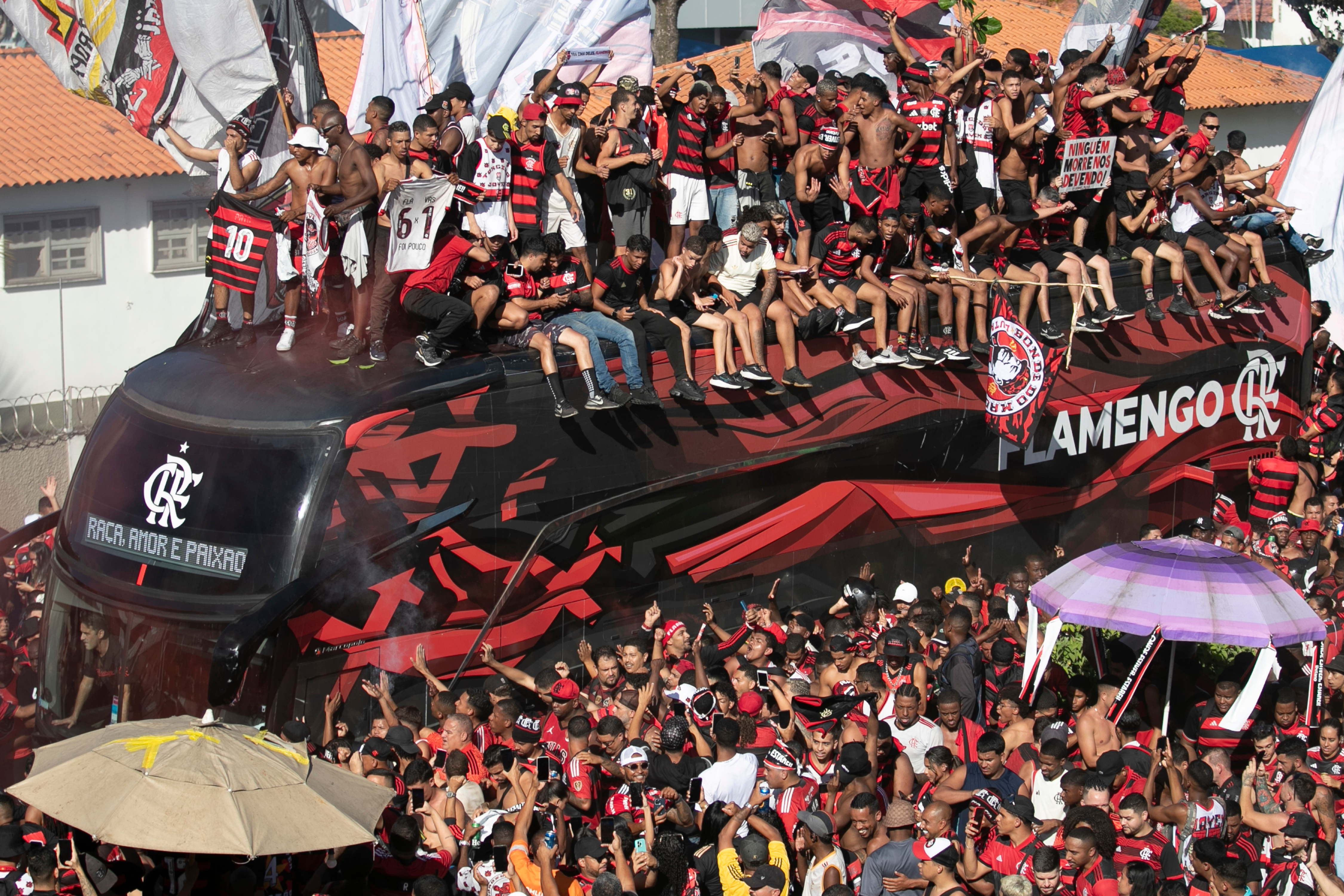 Flamengo soccer fans see their team off as it arrives to the airport before flying to Peru for the Copa Libertadores final