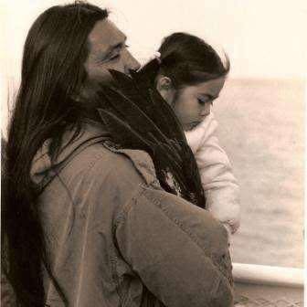 Isidro Gali Jr carries Morning Star Gali in his arms as they travel on the ferry to Alcatraz