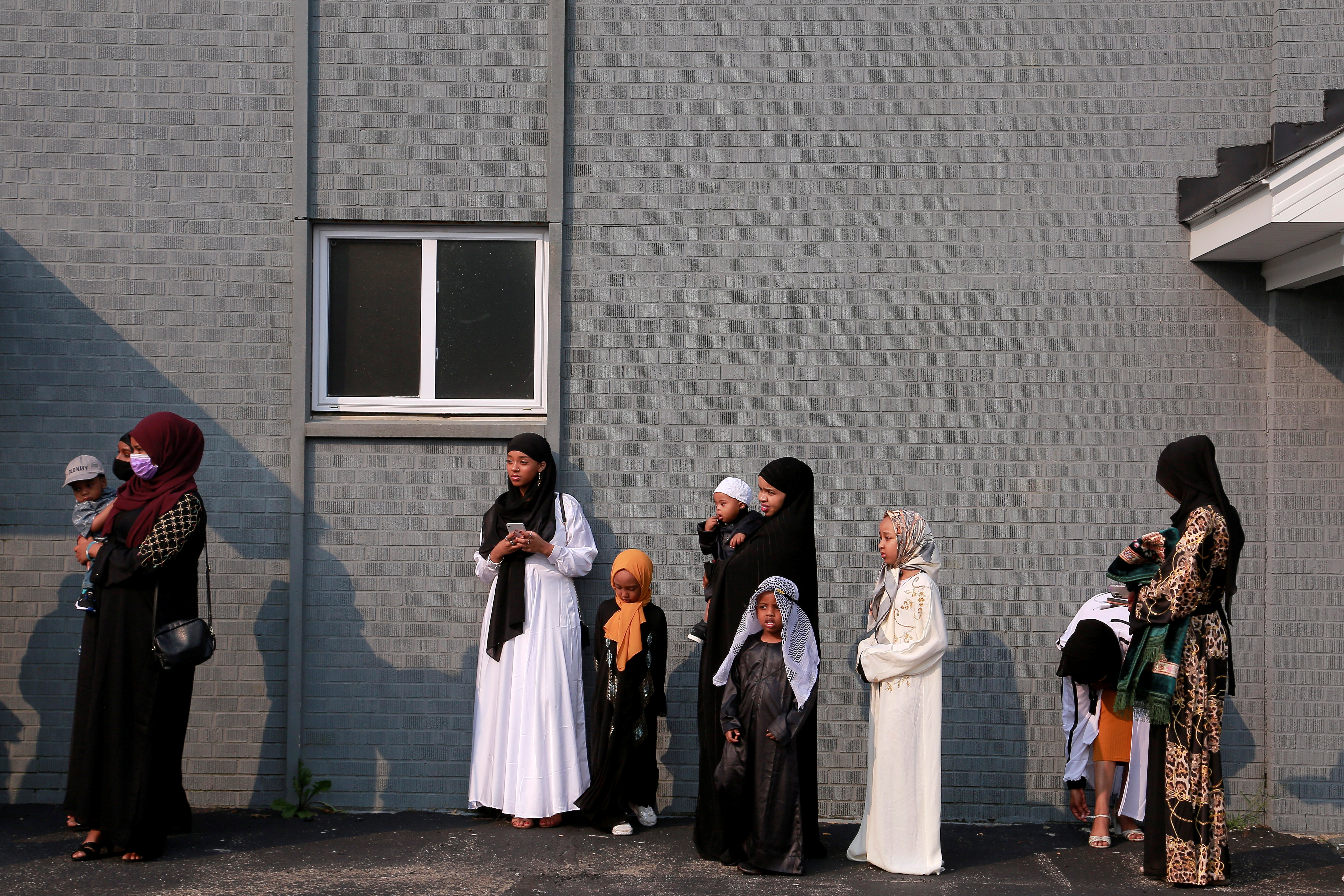 Somali community gathers in front of a mosque