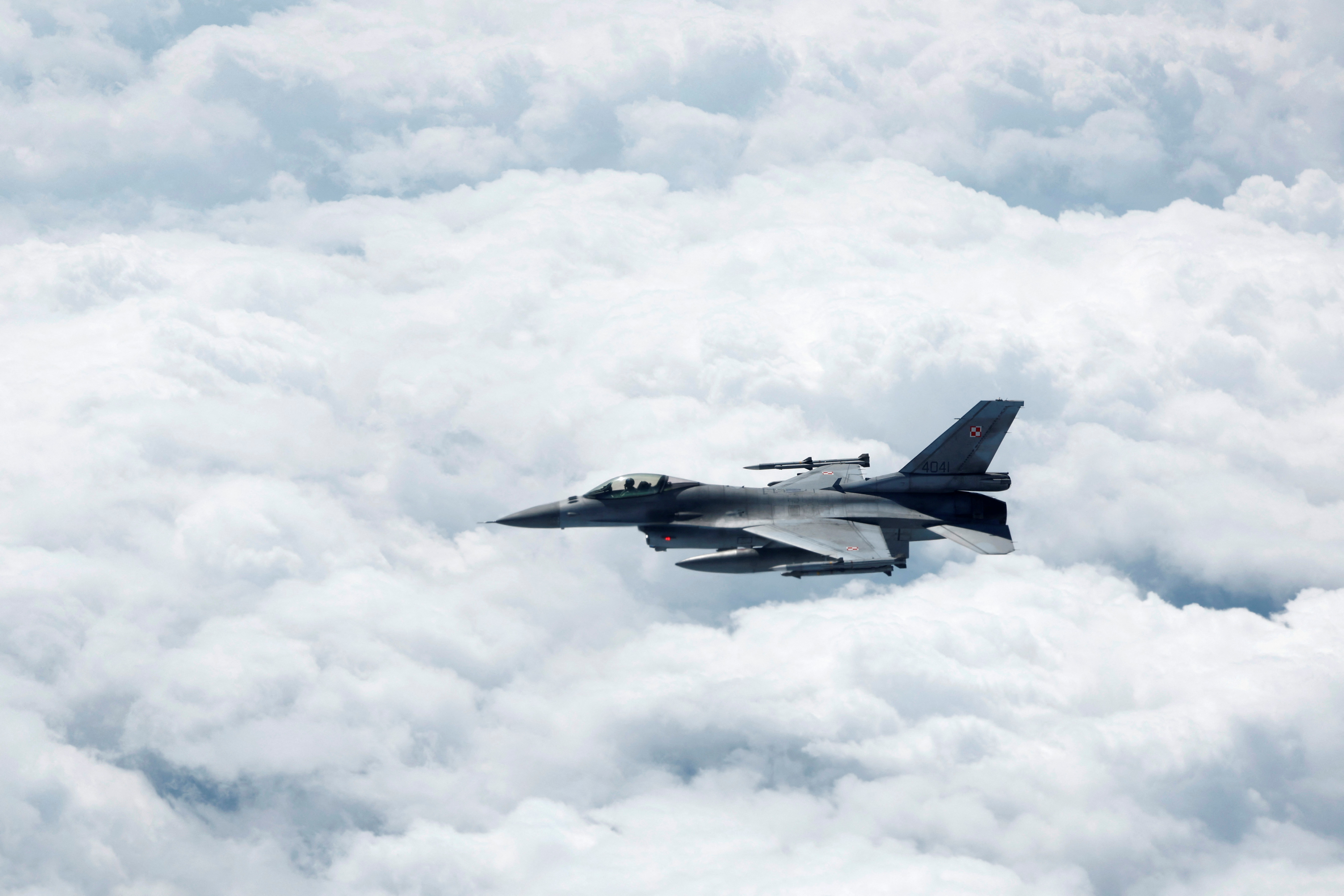 A Polish Air Force F-16 fighter jet flies during a media day illustrating how NATO Air Policing safeguards the Allies' airspace in the northern and northeastern region of the Alliance, July 4, 2023. REUTERS/Piroschka van de Wouw