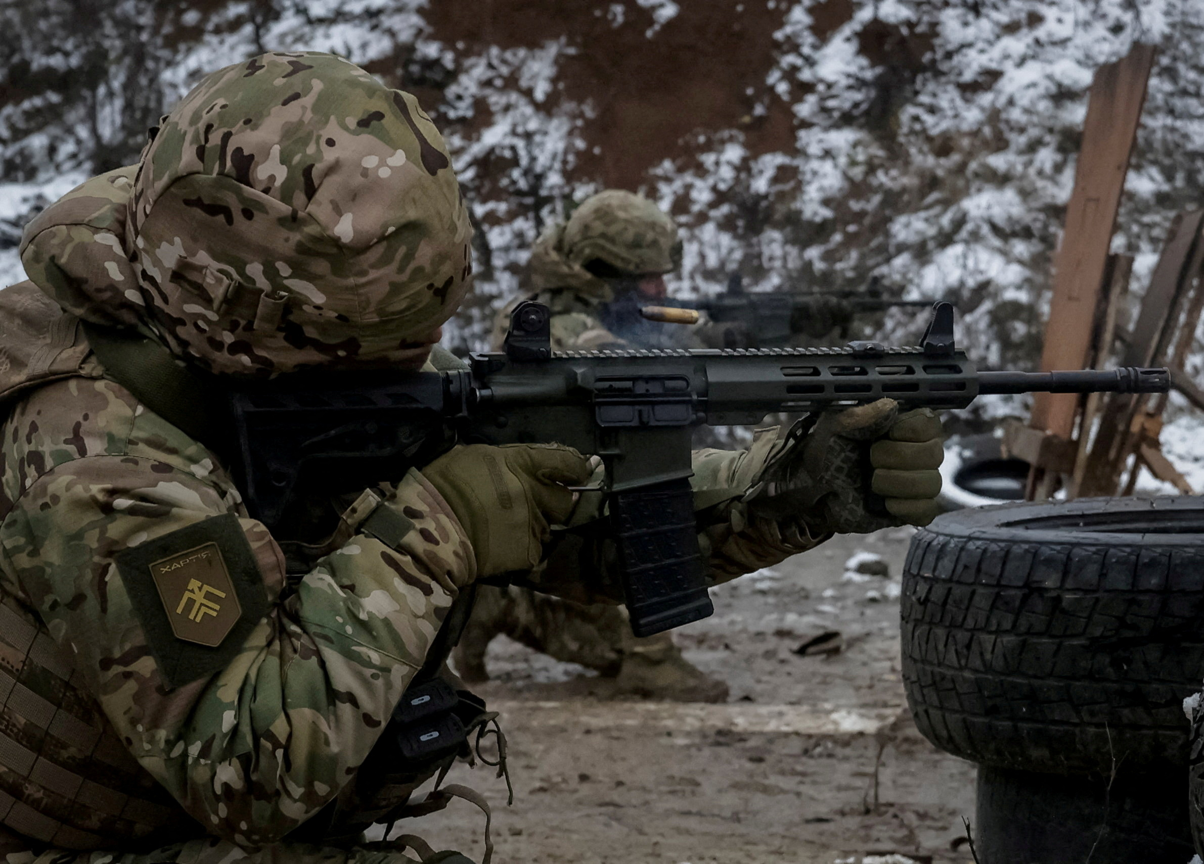 FILE PHOTO: A serviceman of the 13th Operative Purpose Brigade 'Khartiia' of the National Guard of Ukraine fires a weapon during shooting practice between combat missions, amid Russia's attack on Ukraine, in Kharkiv region, Ukraine December 10, 2025. REUTERS/Sofia Gatilova/File Photo