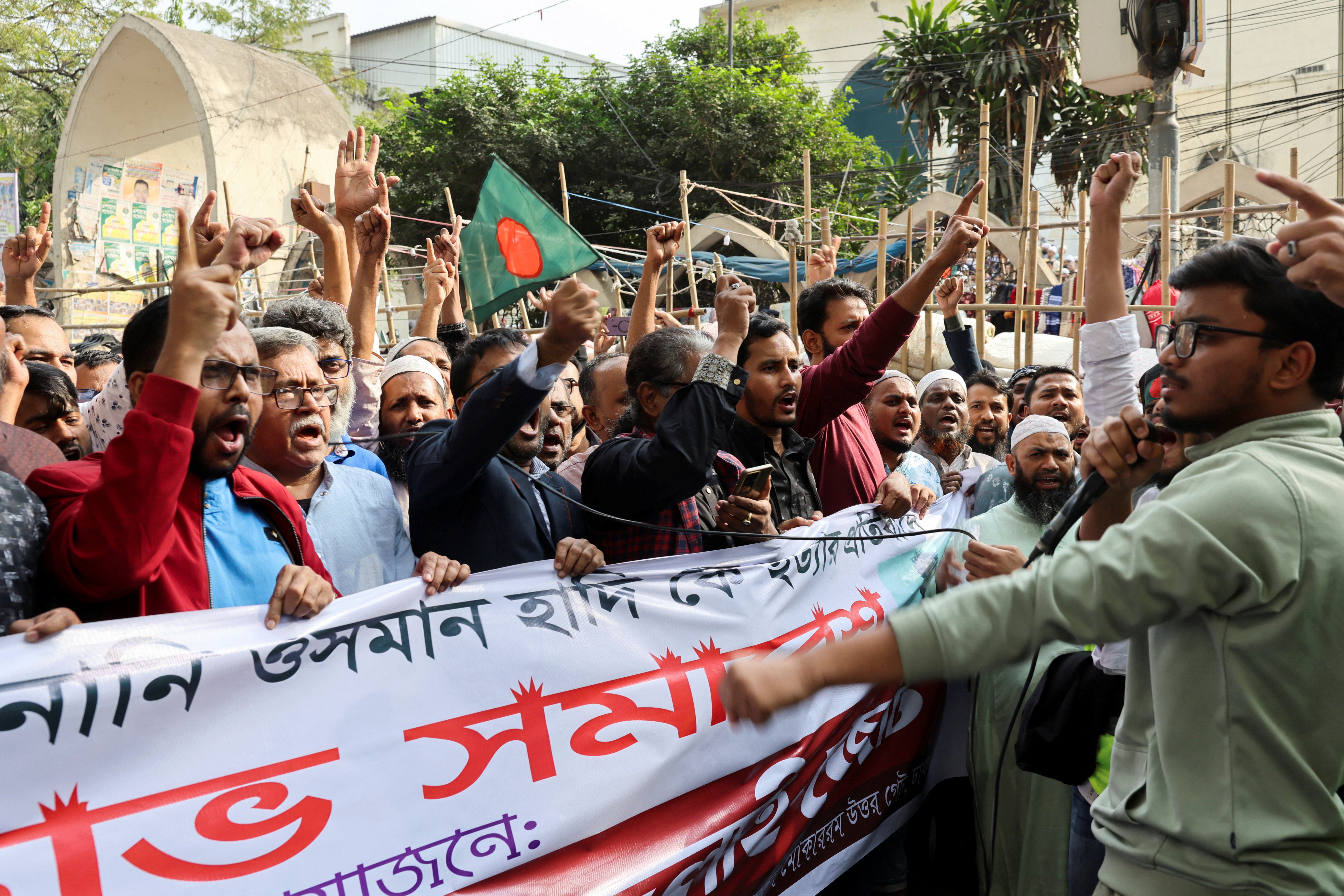 Members of the multiple organisations including Khelafat Majlis chant slogans as they join in a protest rally after Friday prayer, demanding justice for the death of Sharif Osman Hadi in Dhaka, Bangladesh, December 19, 2025. [Mohammad Ponir Hossain/Reuters]
