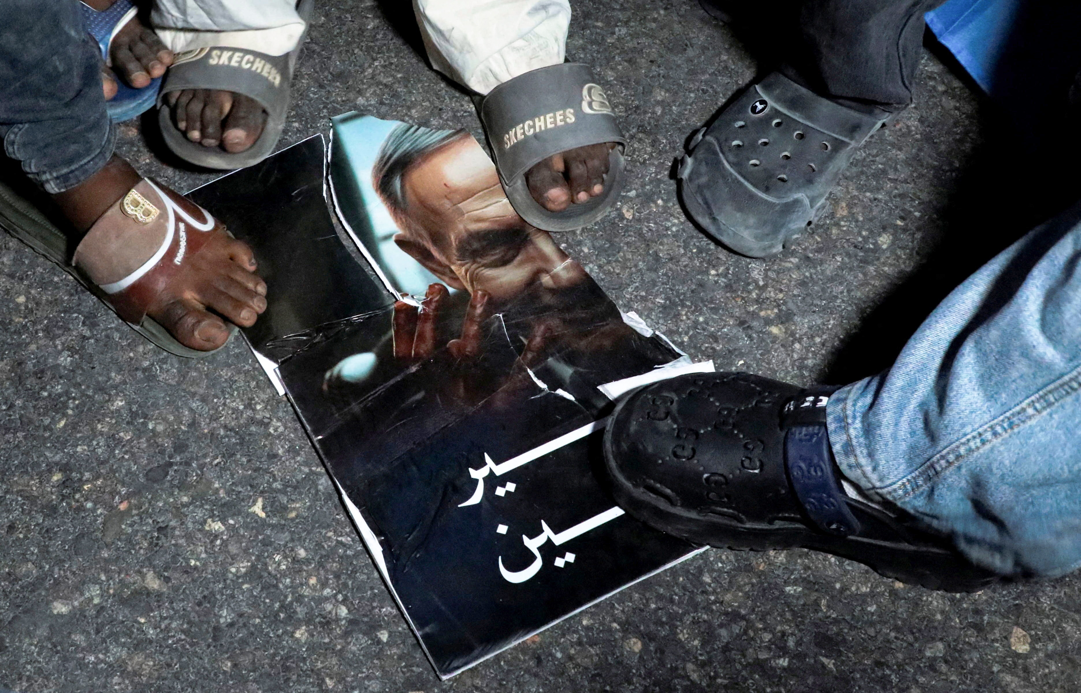Somalis step on a torn image depicting Israeli Prime Minister Benjamin Netanyahu during a demonstration after Israel became the first country to formally recognise the self-declared Republic of Somaliland