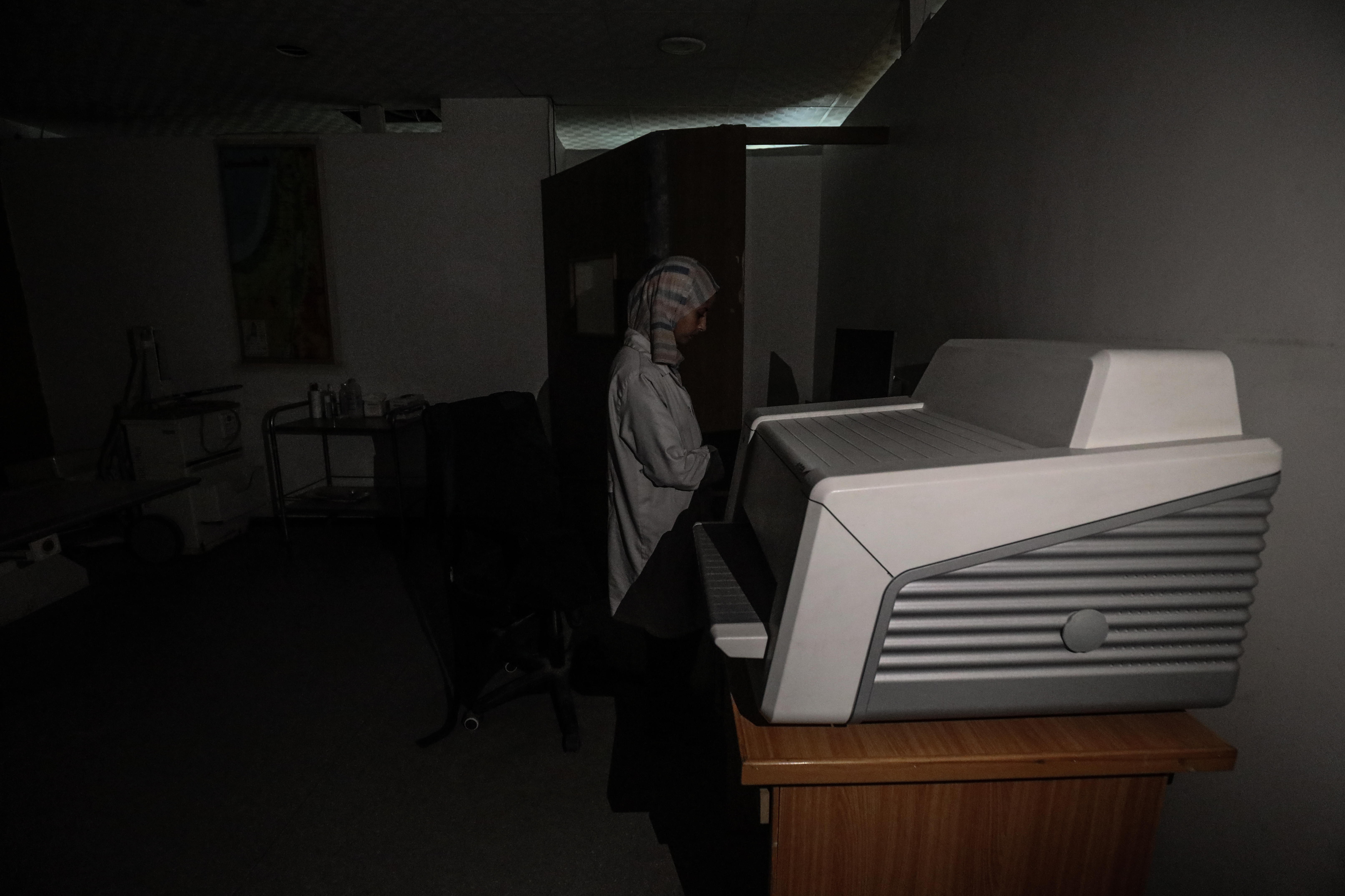 A medical staff is seen at Al-Awda Hospital which has announced that it has suspended medical services due to running out of fuel needed to operate its electric generators in the Nuseirat Refugee Camp, Deir al-Balah, Gaza