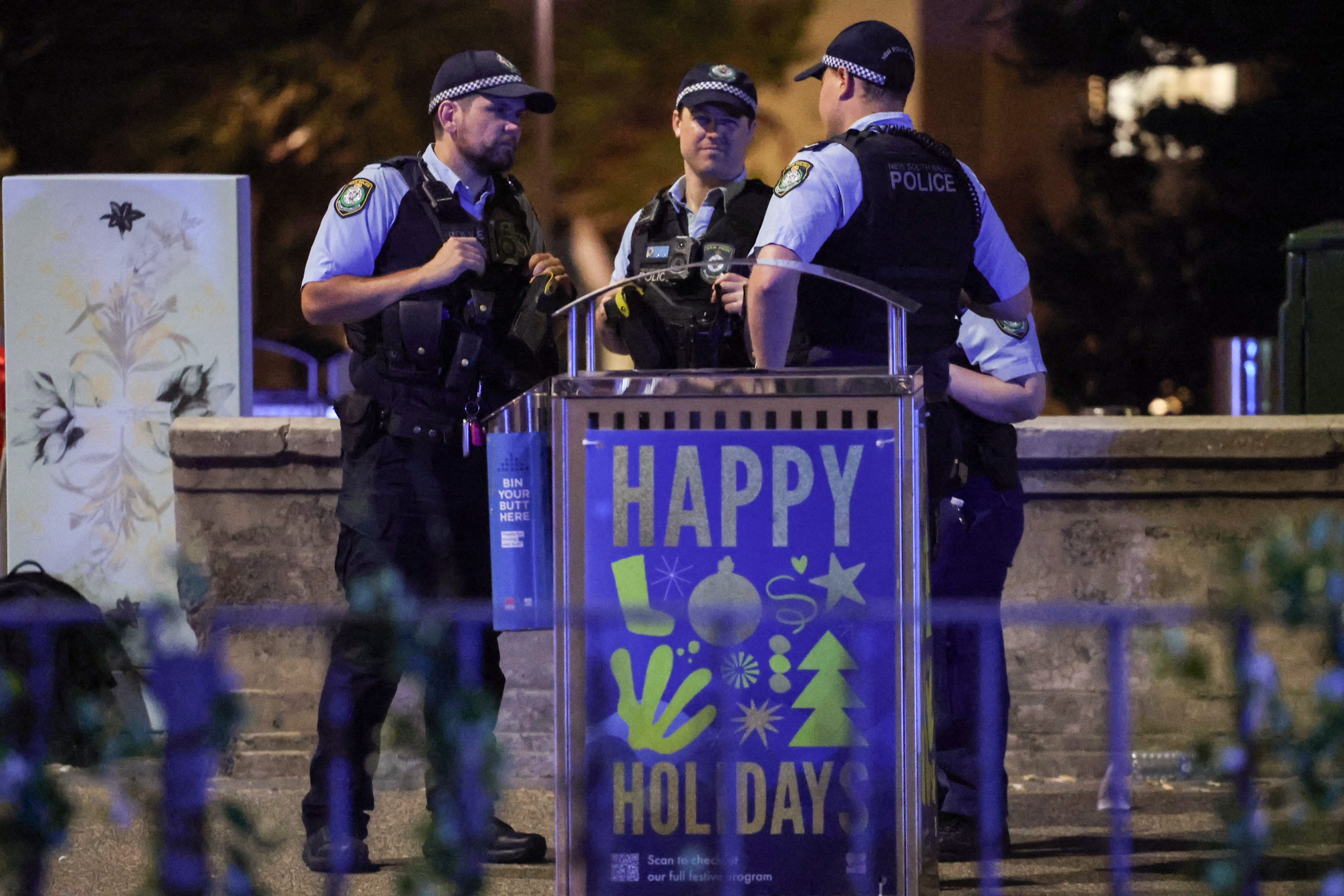 Police work on a street after a shooting incident at Bondi Beach