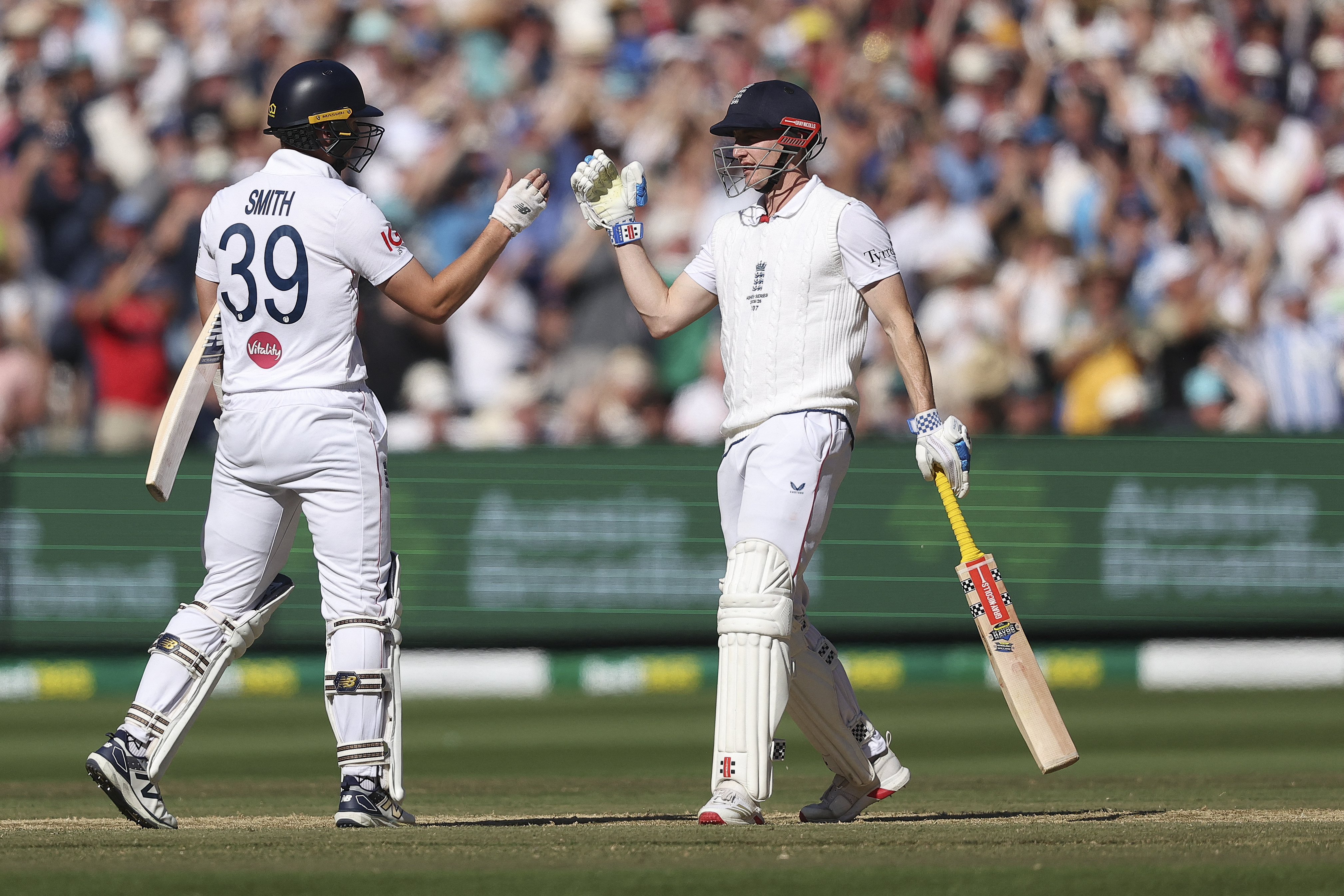Harry Brook and Jamie Smith react.