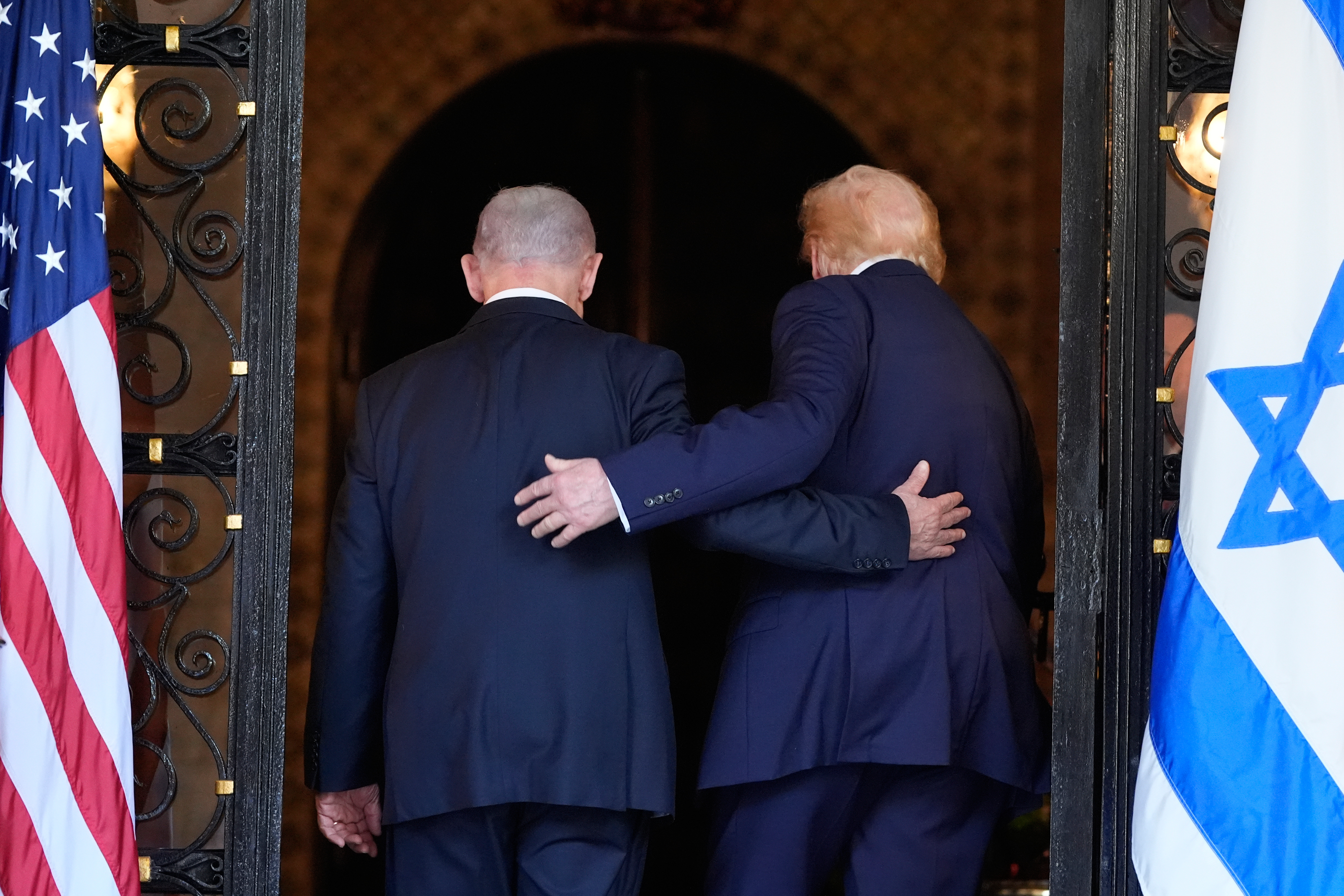 Trump and Netanyahu, each with a hand on the other's back